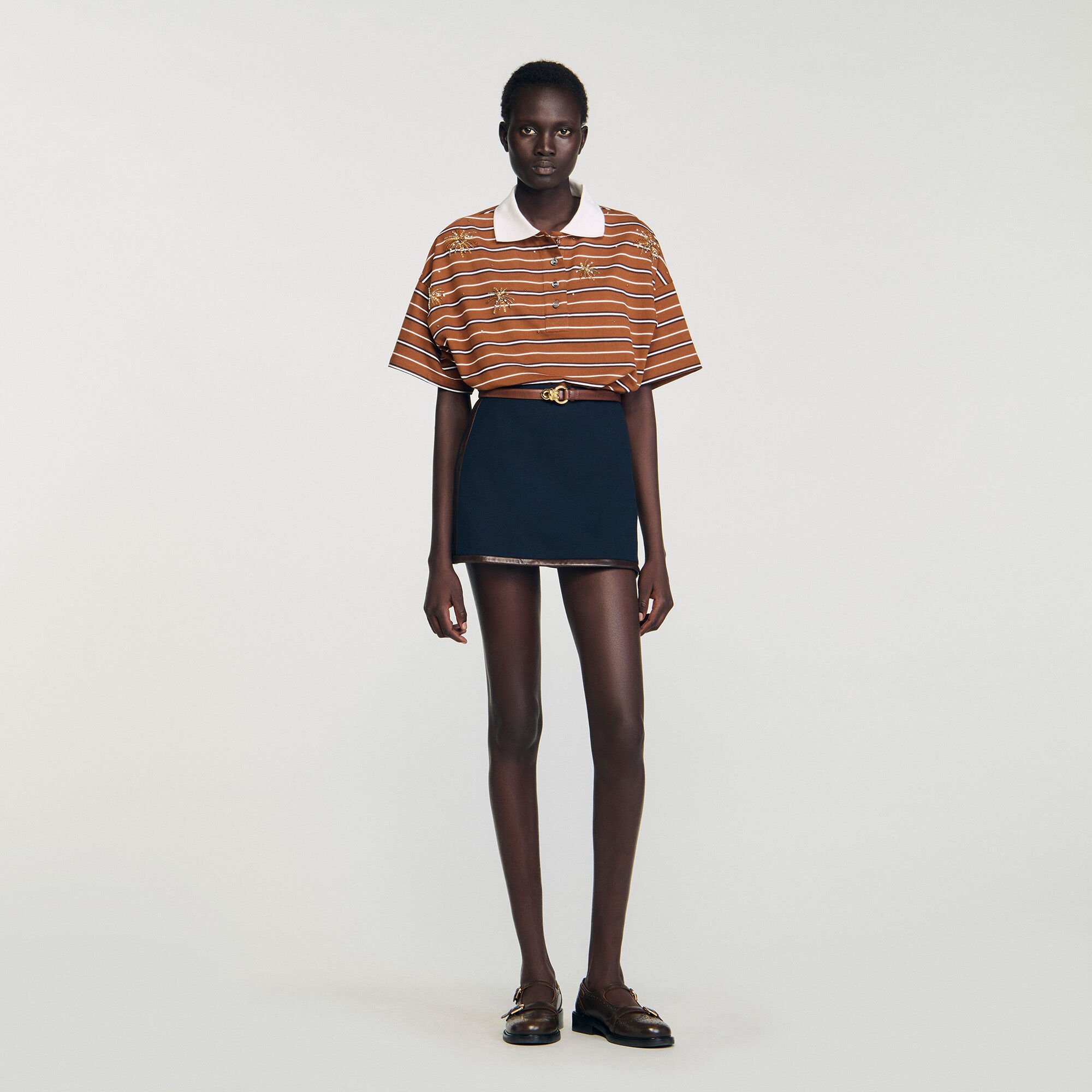 Mini skirt with leather bands