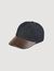 Denim and leather cap