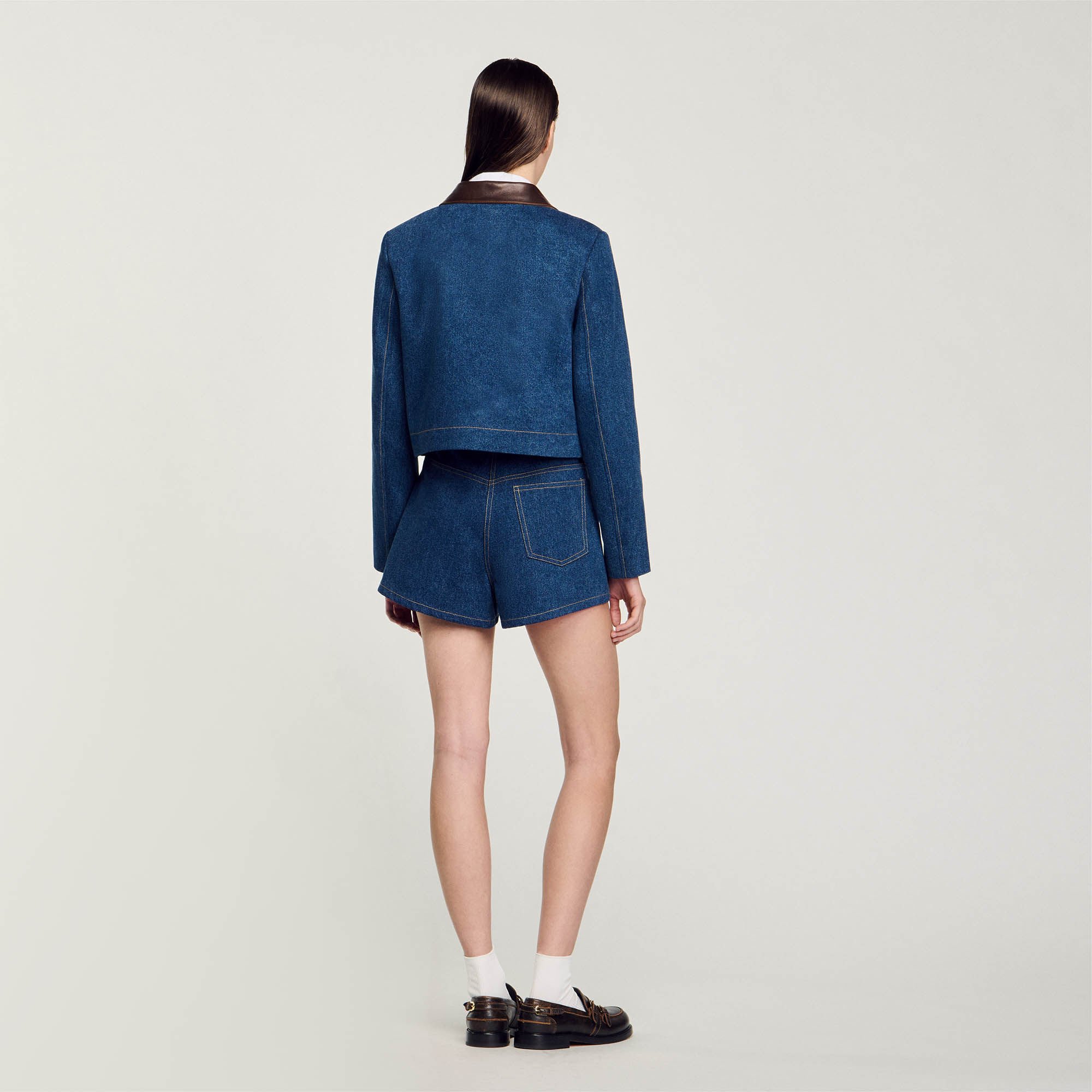 Denim jacket with leather collar