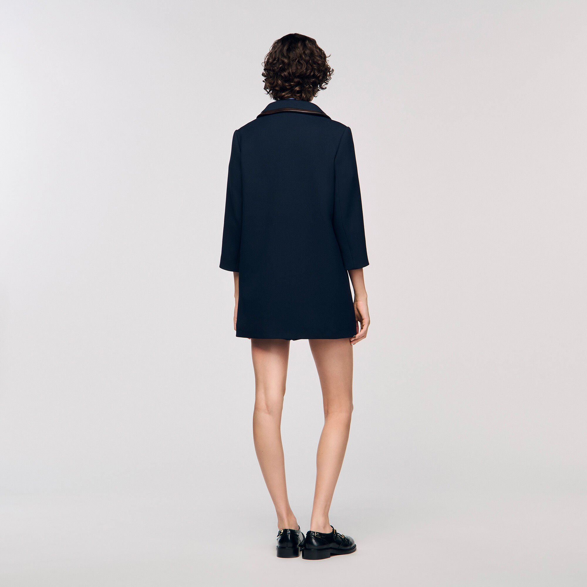Coat with leather stripes