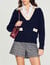 Cable knit sweater with low neckline