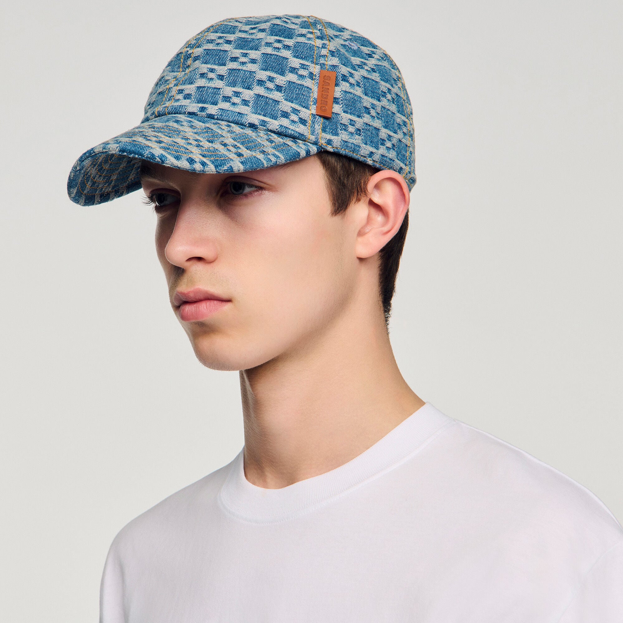 Denim cap with cross motif