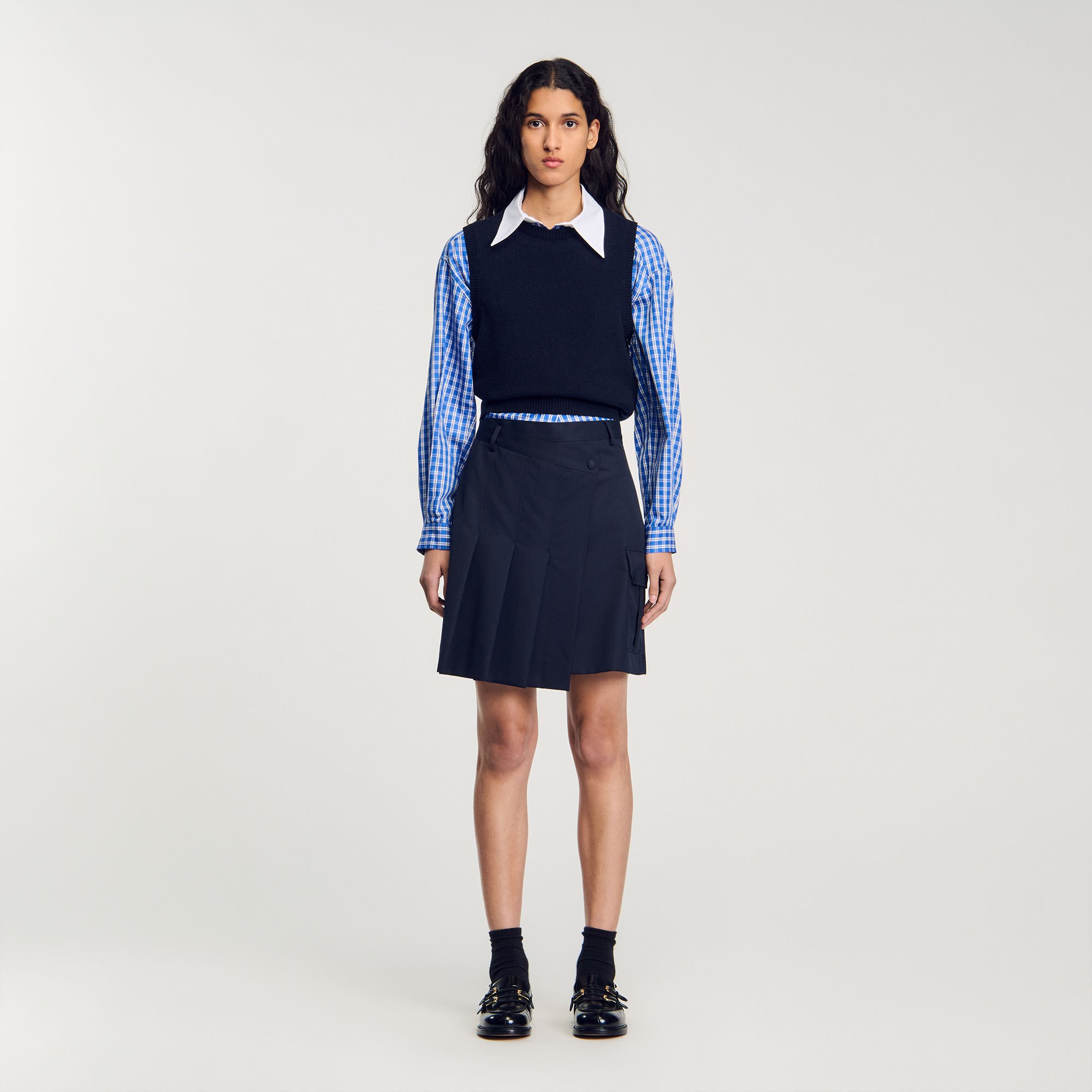 Short asymmetrical pleated skirt