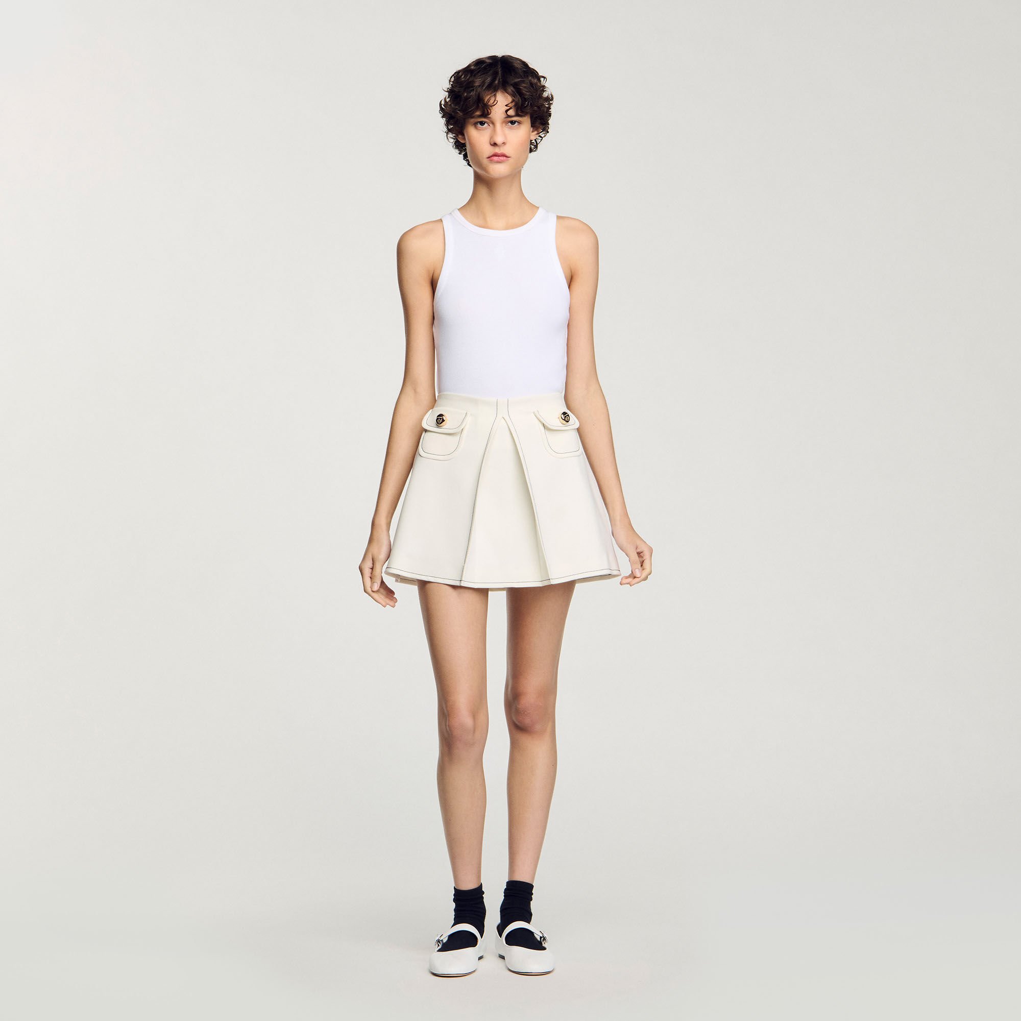 Short box-pleated skirt