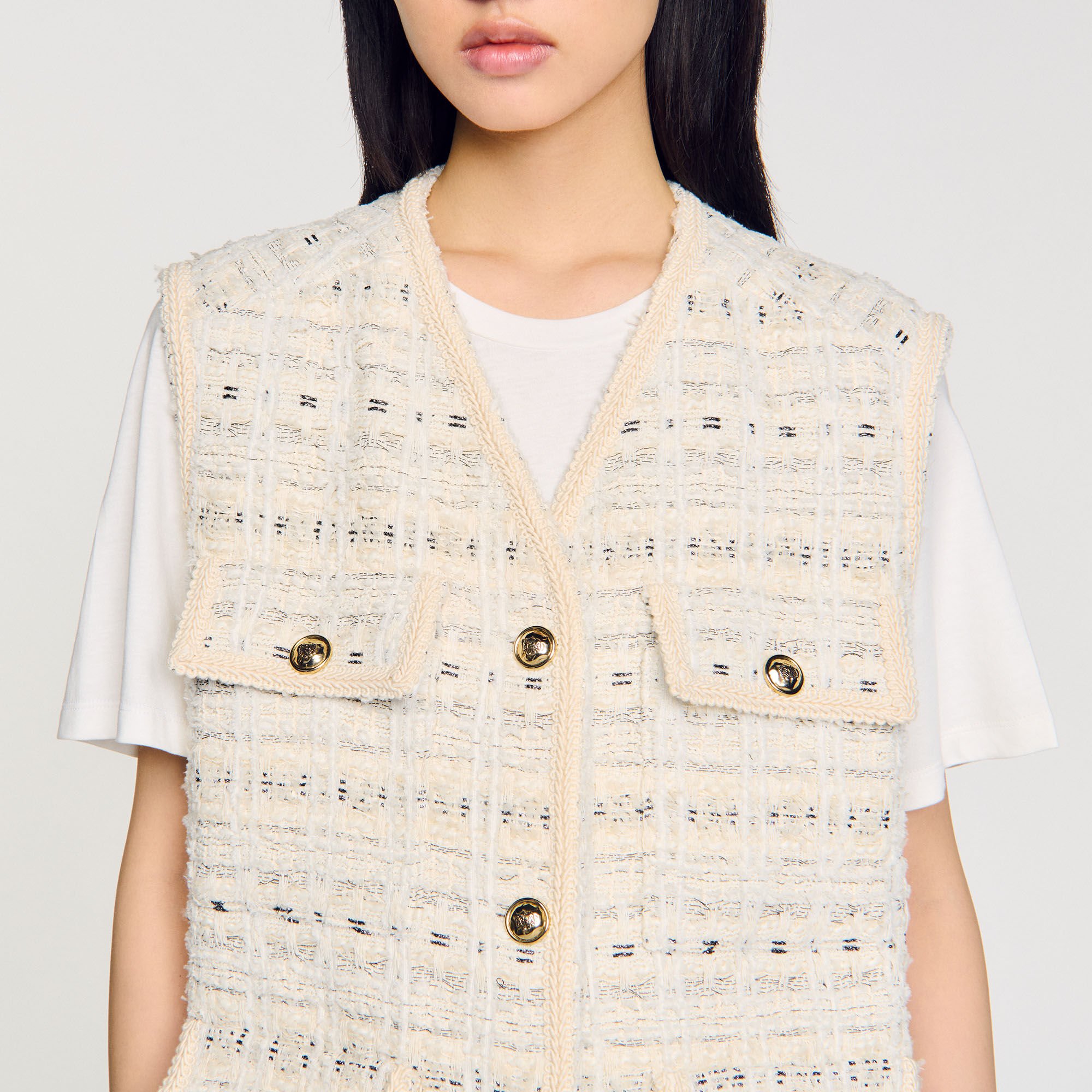 Sleeveless tweed jacket