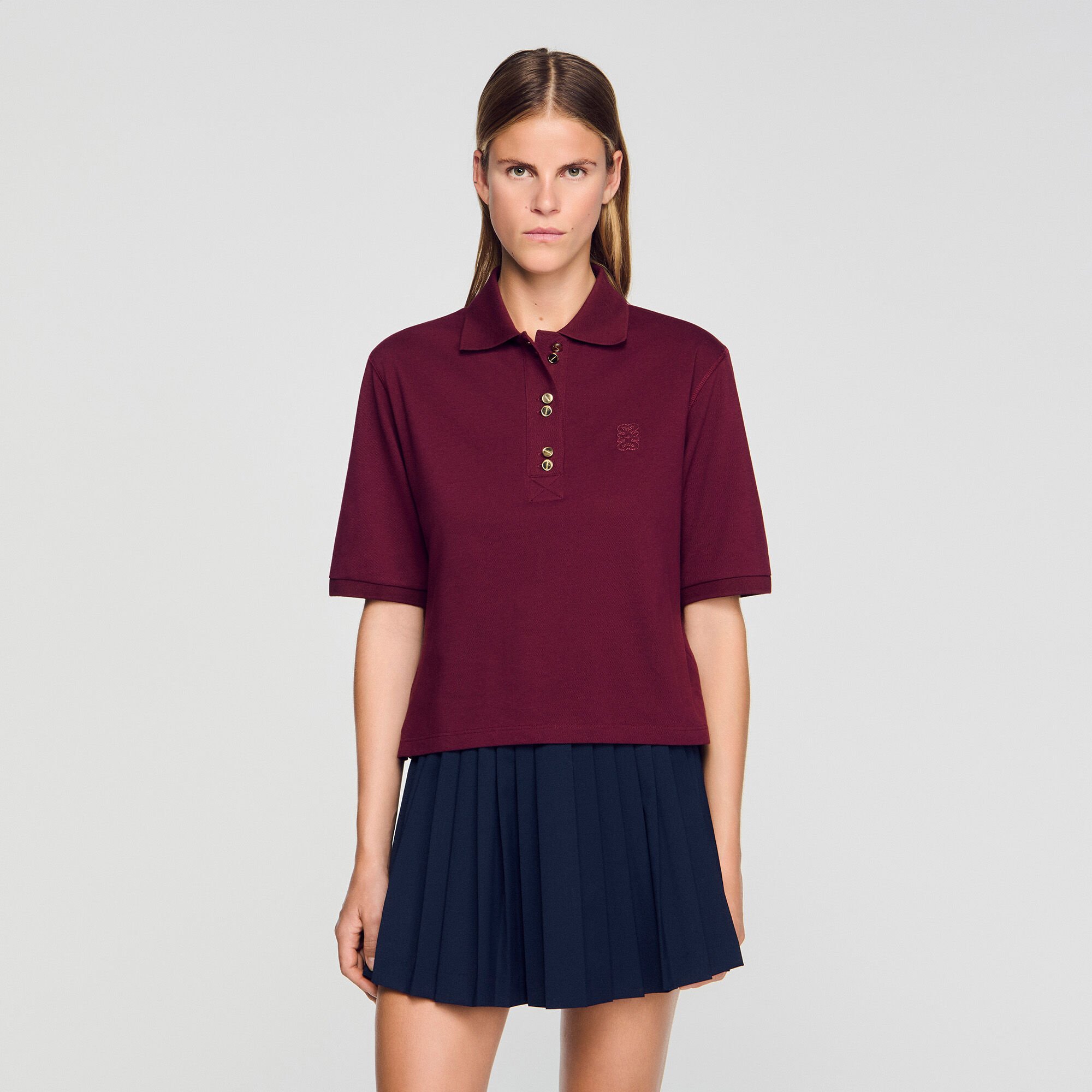 Polo shirt with decorative buttons