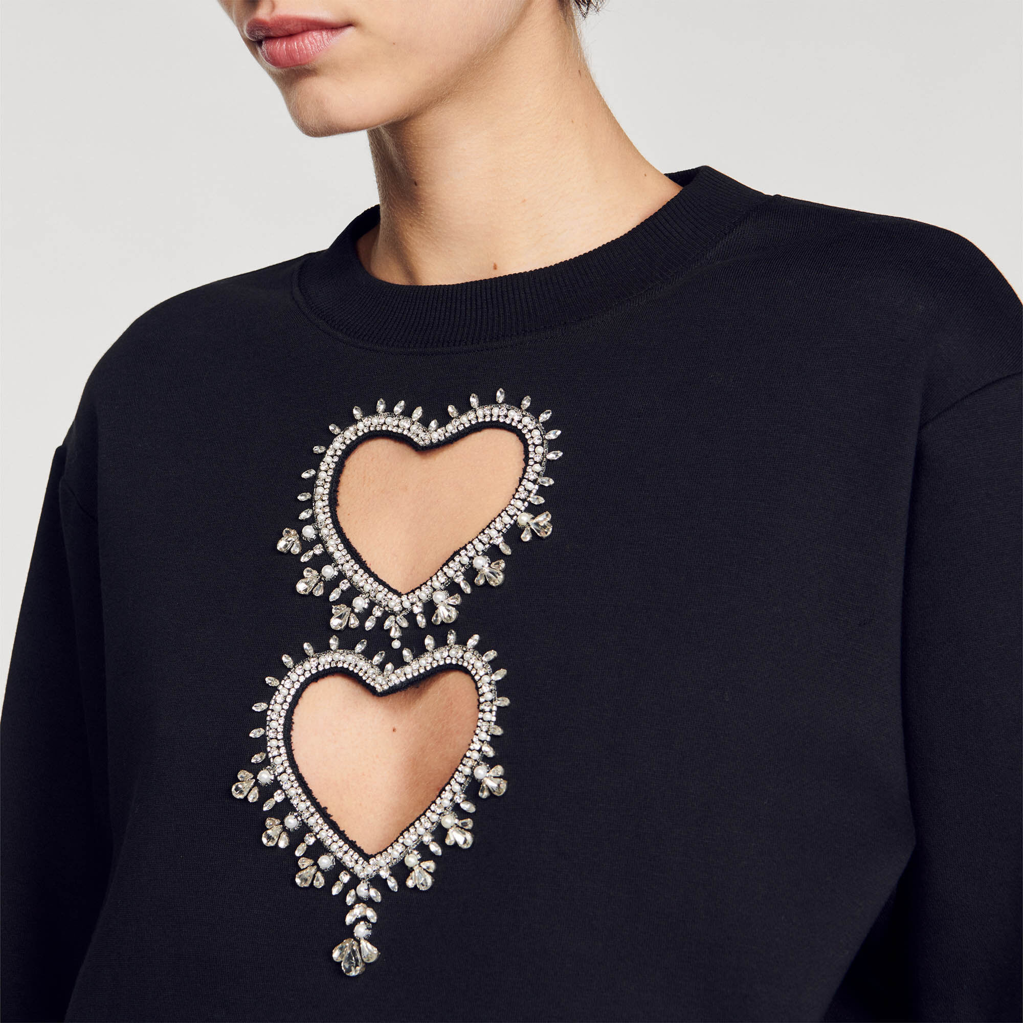 Sweatshirt with rhinestone hearts