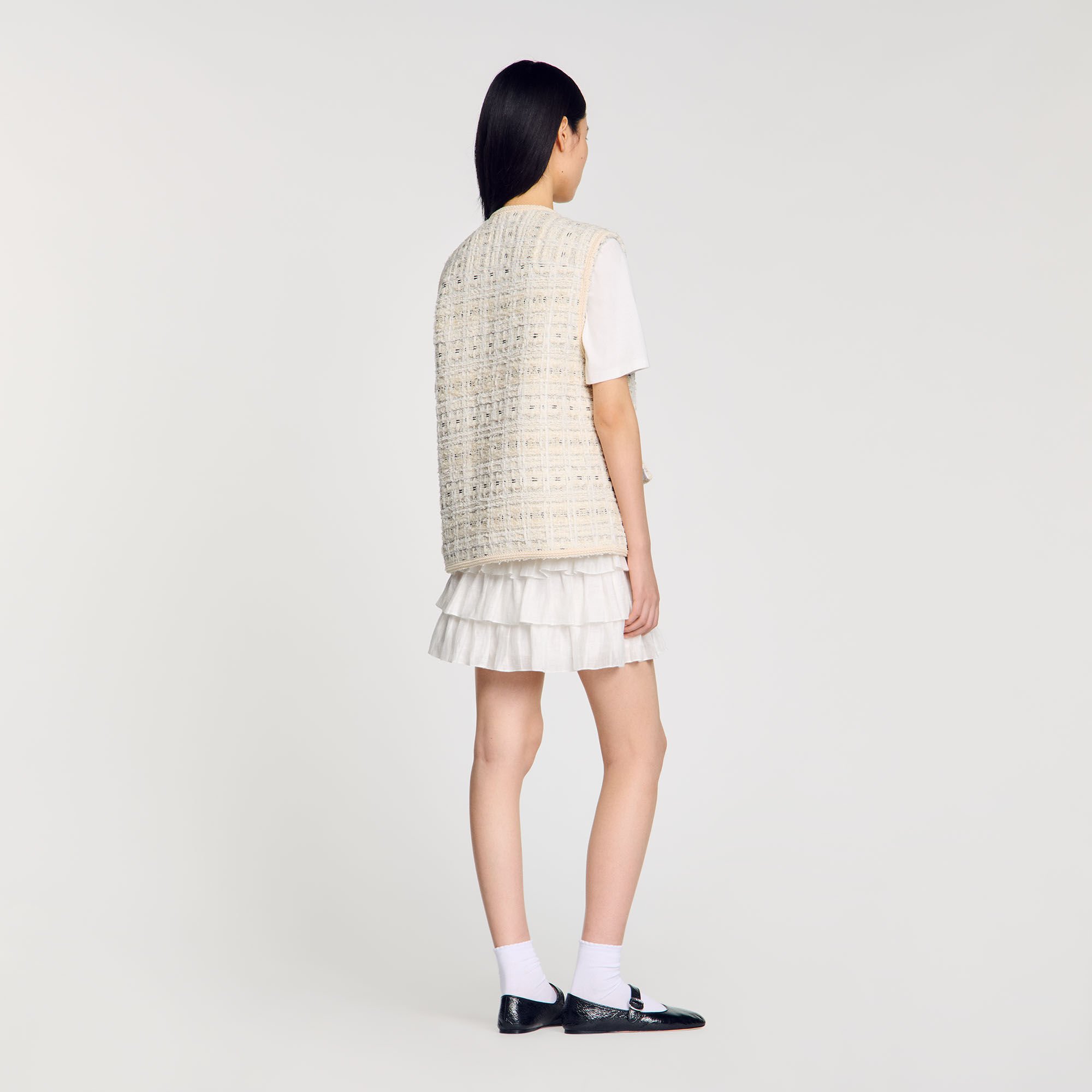 Sleeveless tweed jacket
