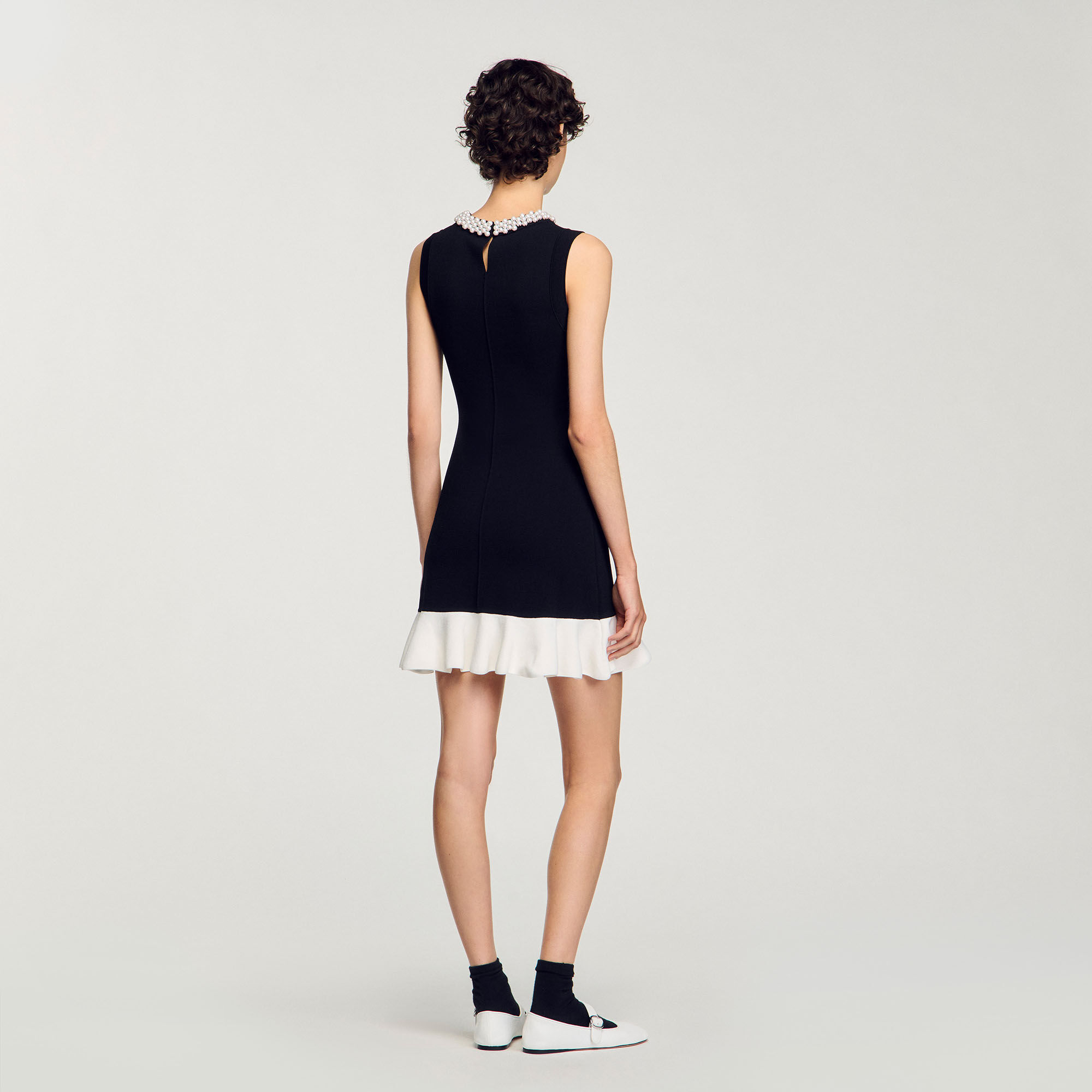 Mini knit dress with beaded neck