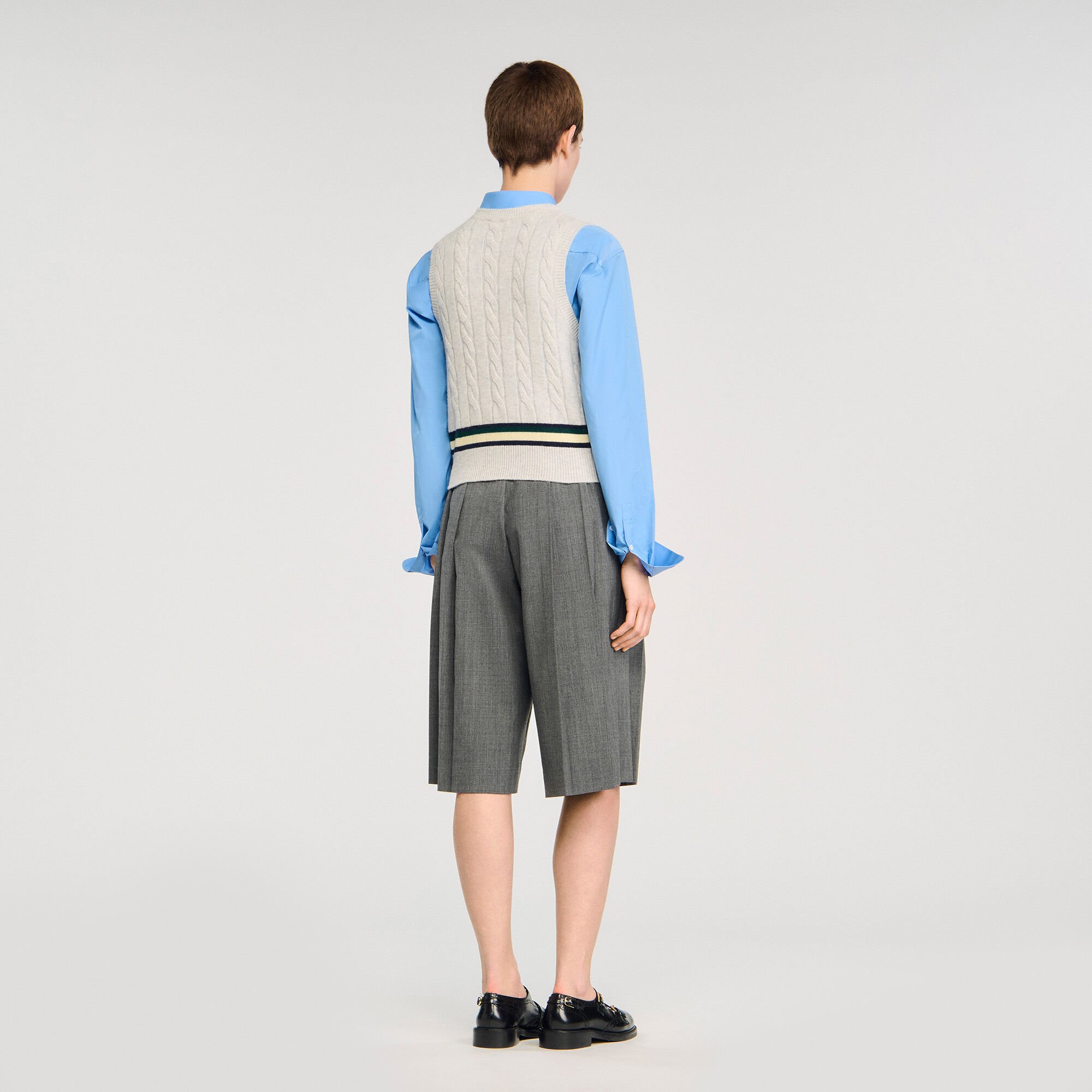 Sleeveless cropped cable knit sweater