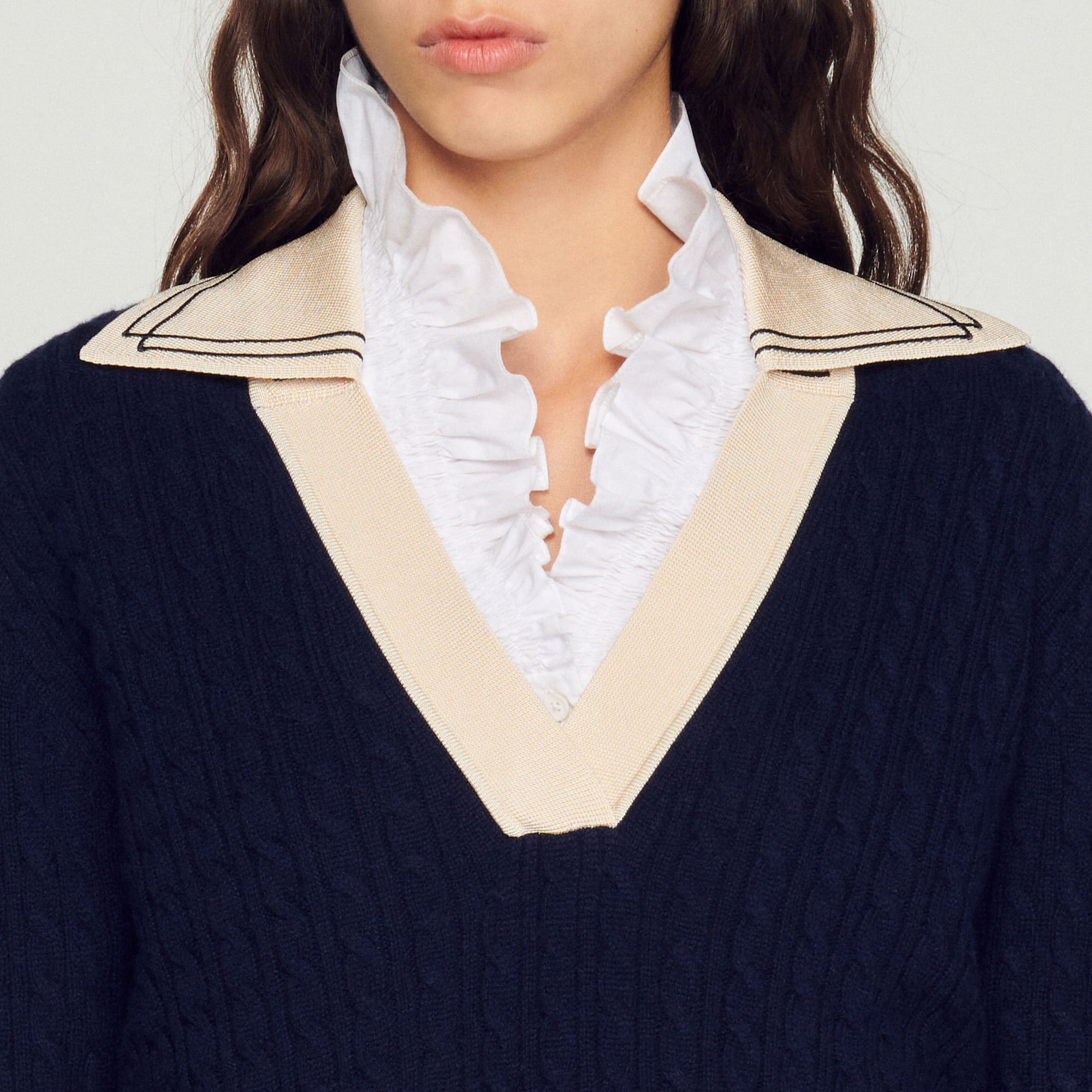 Cable knit sweater with low neckline