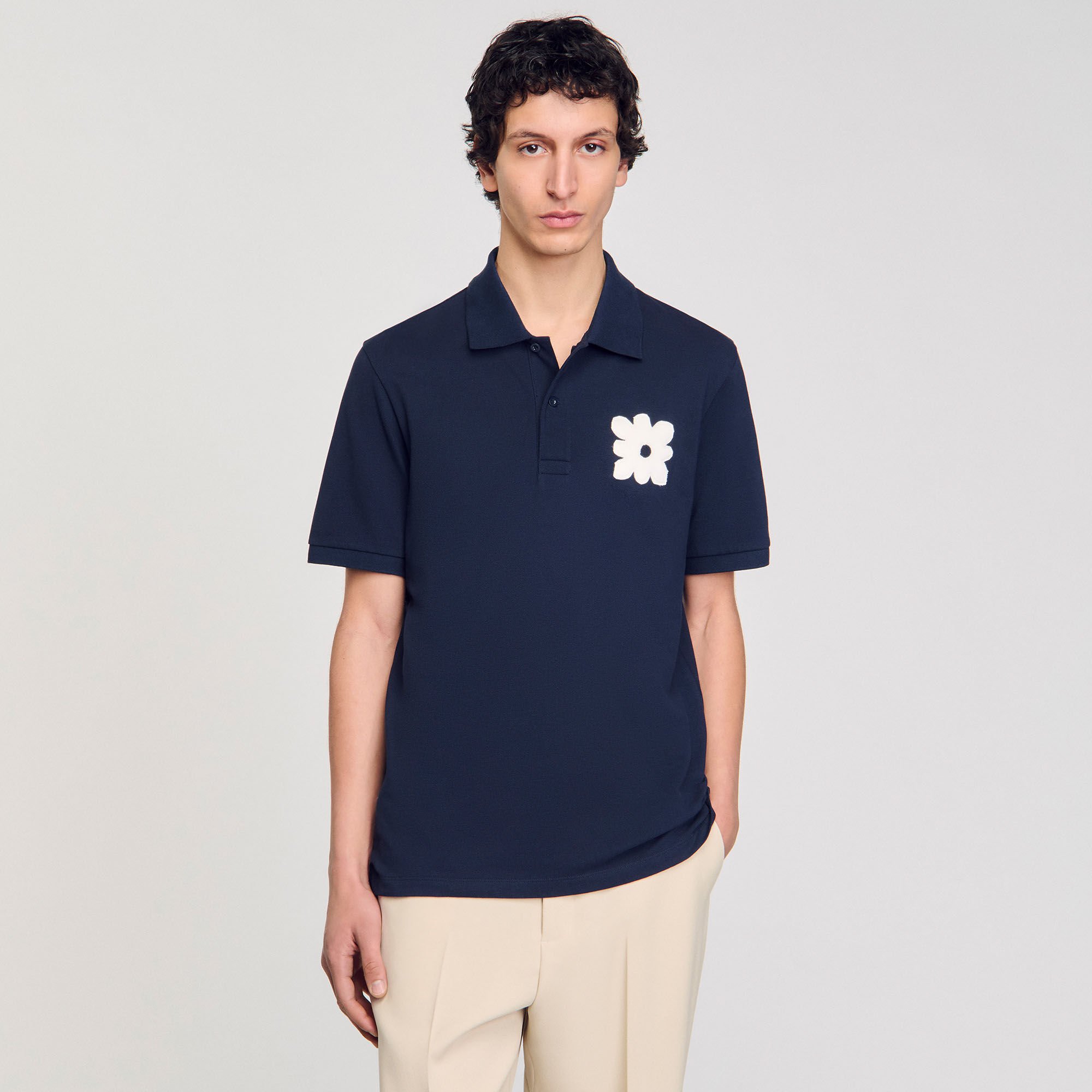 Polo shirt with flower patch