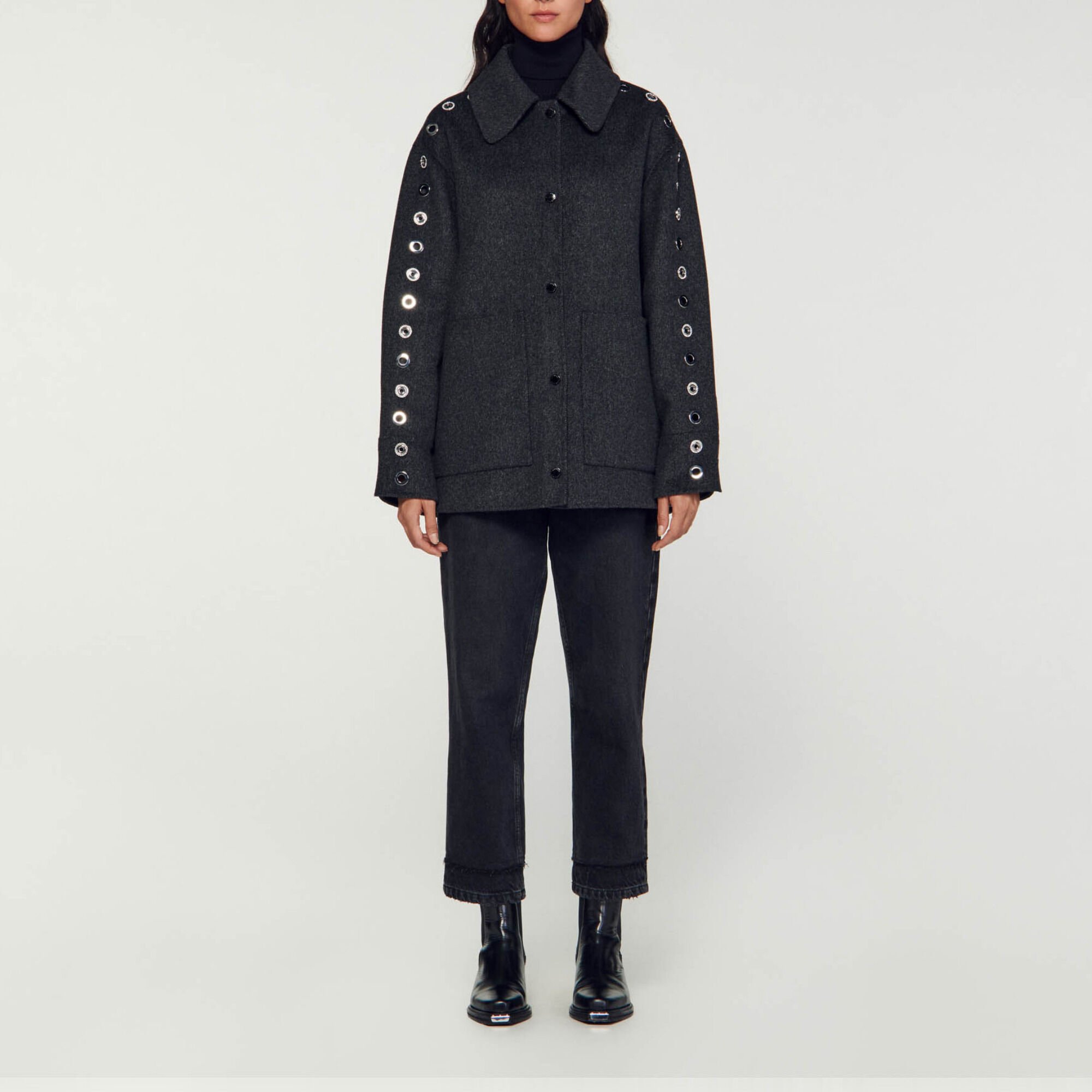 Oversized coat with eyelets