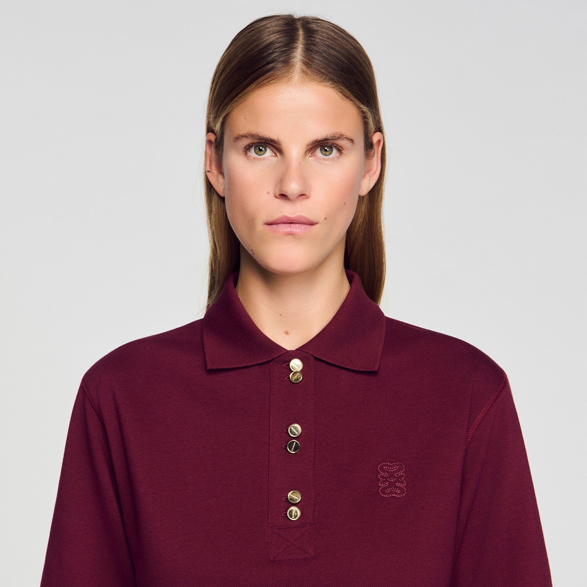 Polo shirt with decorative buttons