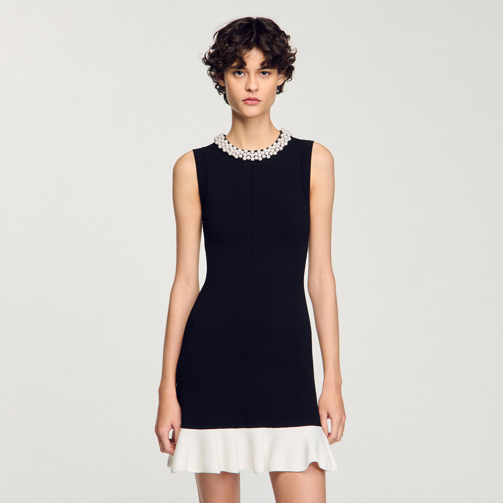 Mini knit dress with beaded neck