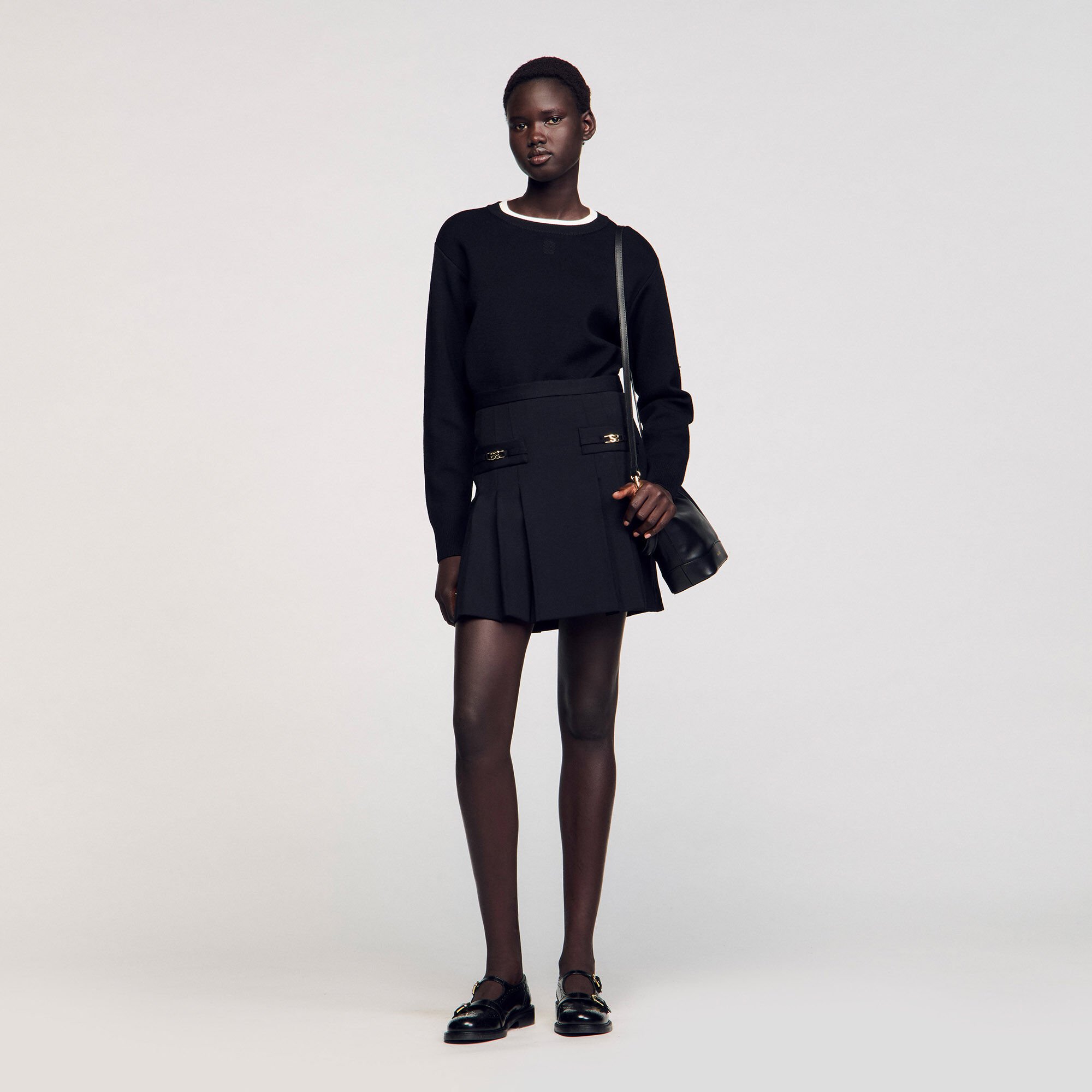 Mini skirt with stitched pleats