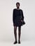 Mini skirt with stitched pleats