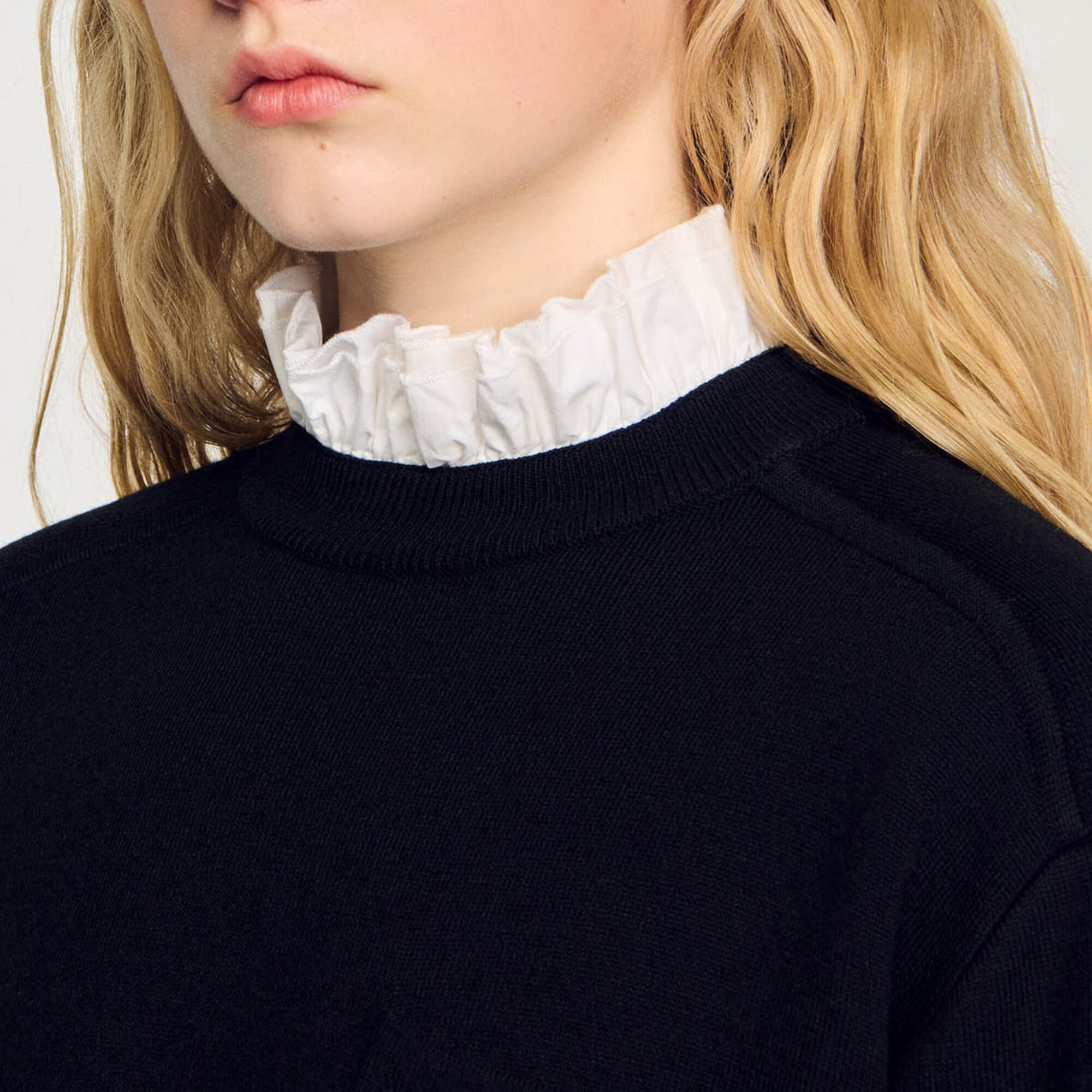 Knitted sweater with high neck