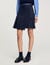 Short asymmetrical pleated skirt