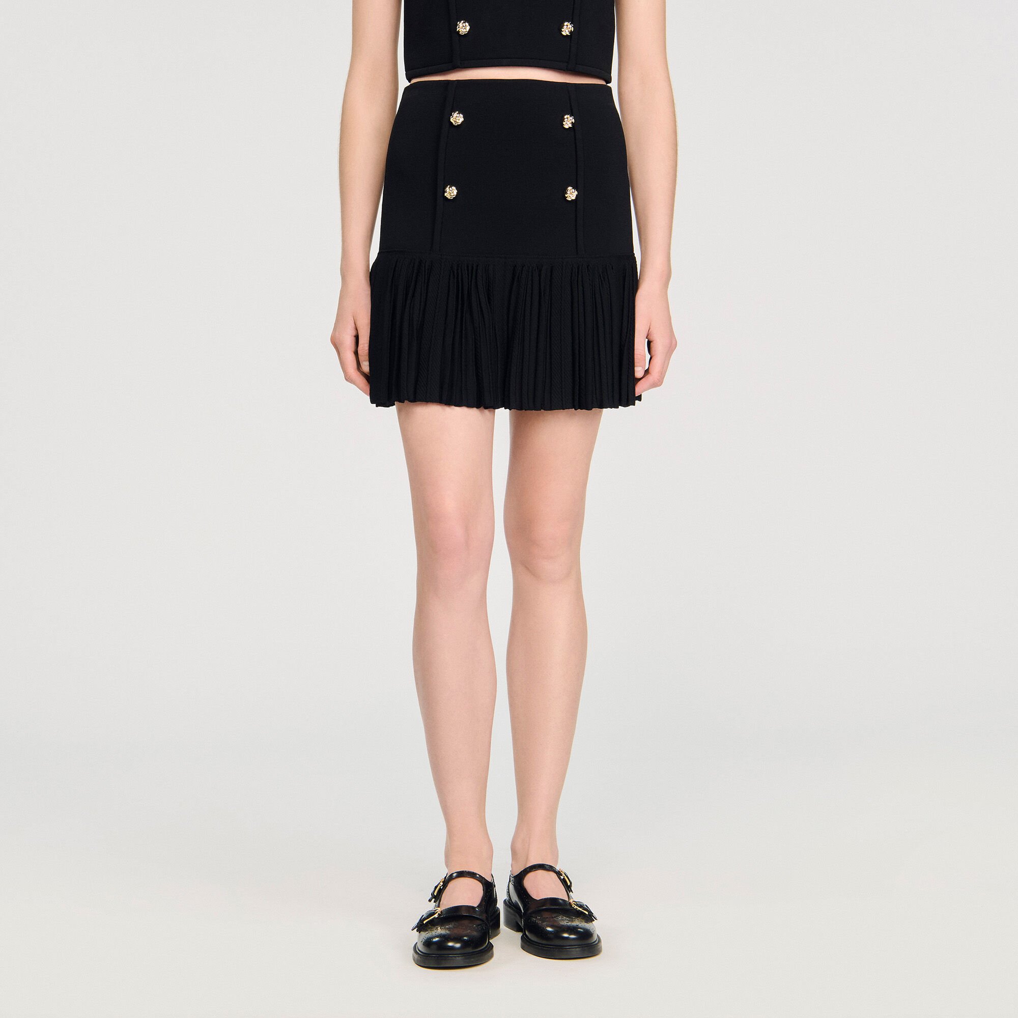 Mini pleated knit skirt