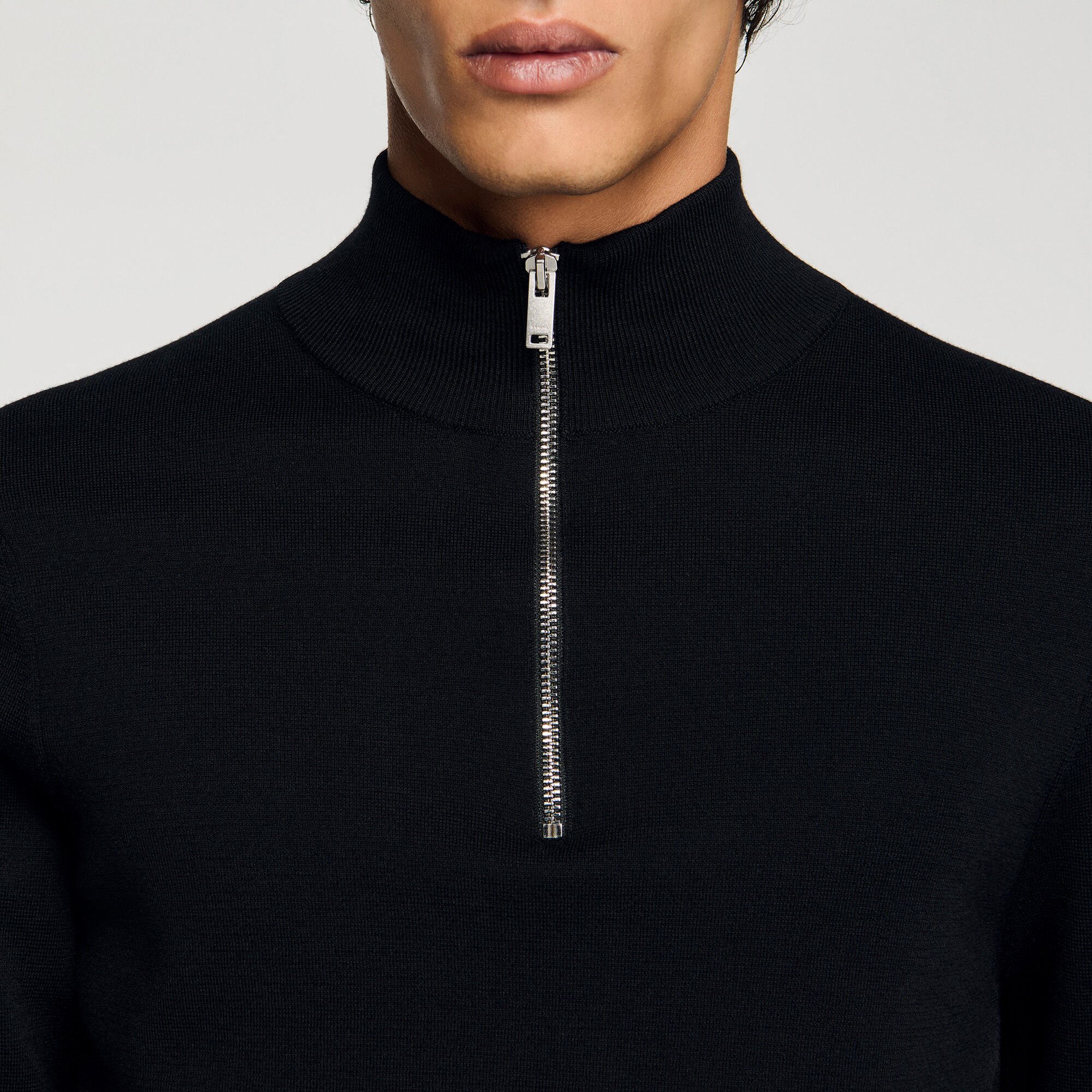 Wool sweater with zipped collar