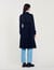 Trench coat with pleated inset