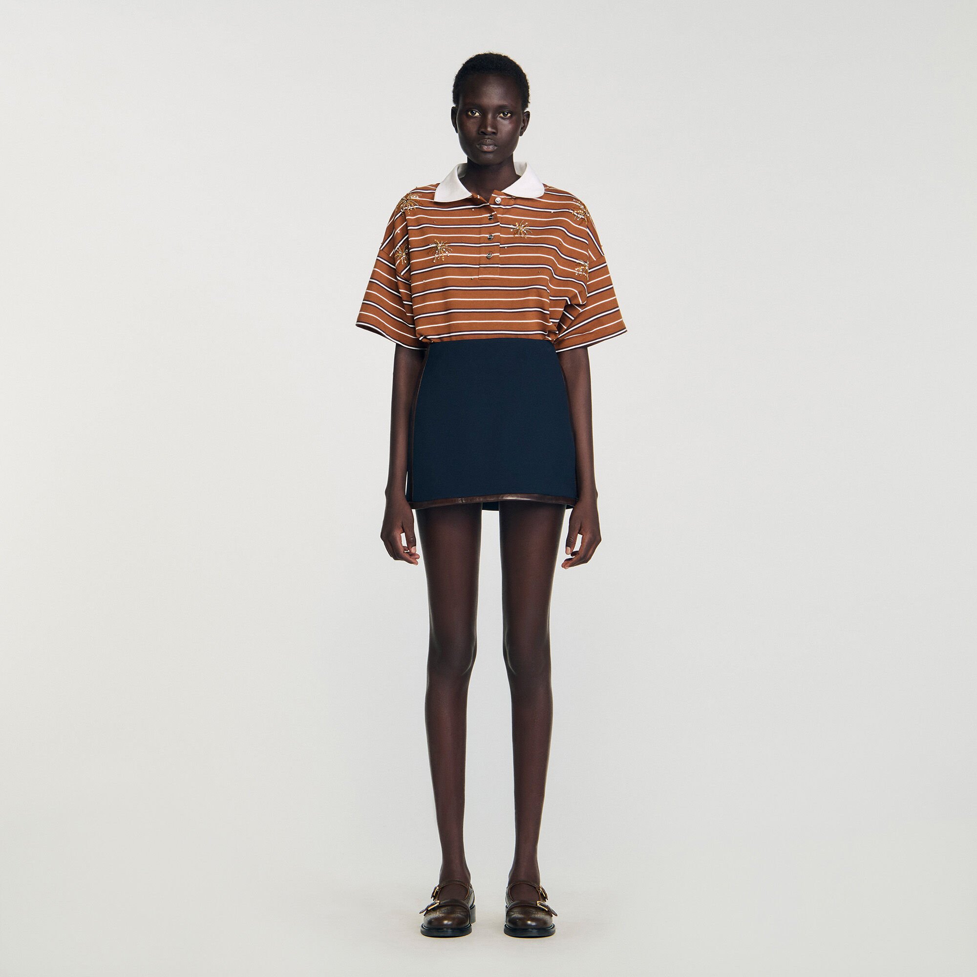 Mini skirt with leather bands