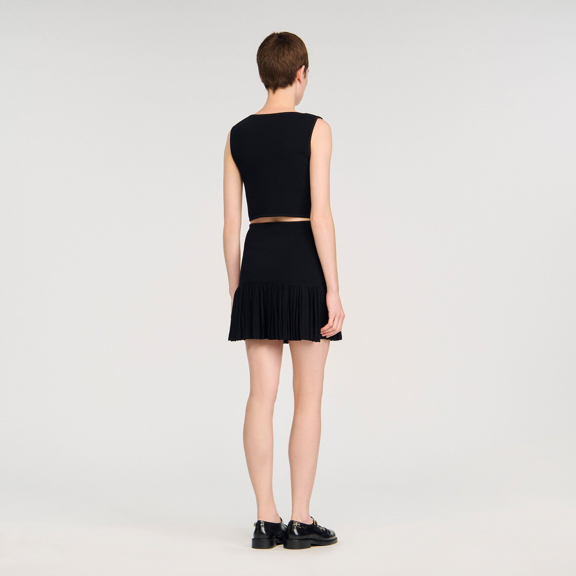 Mini pleated knit skirt