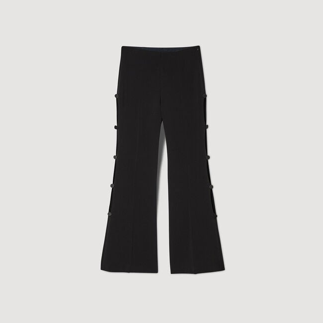 Flared trousers with cutaway sides