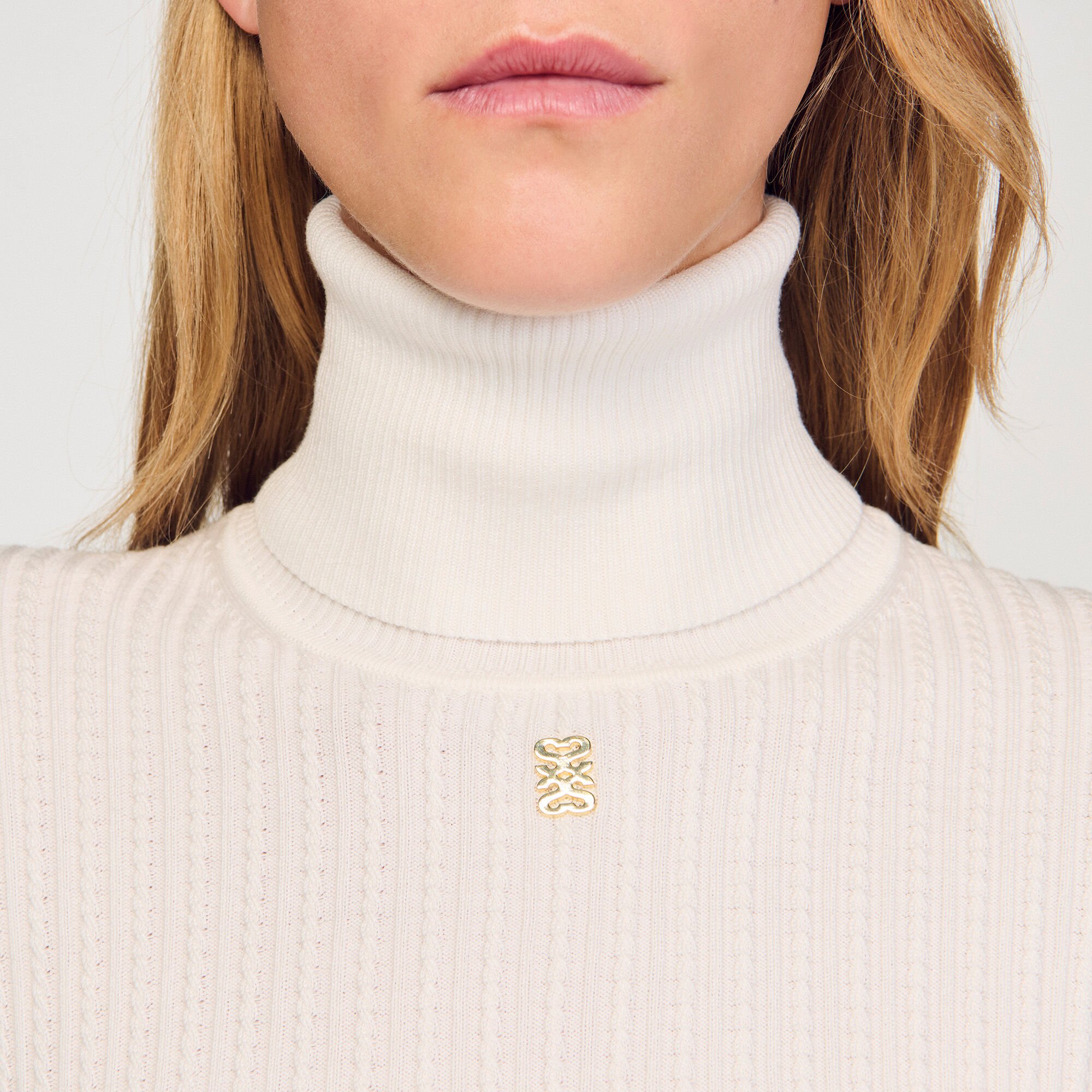 Cable-knit turtleneck sweater