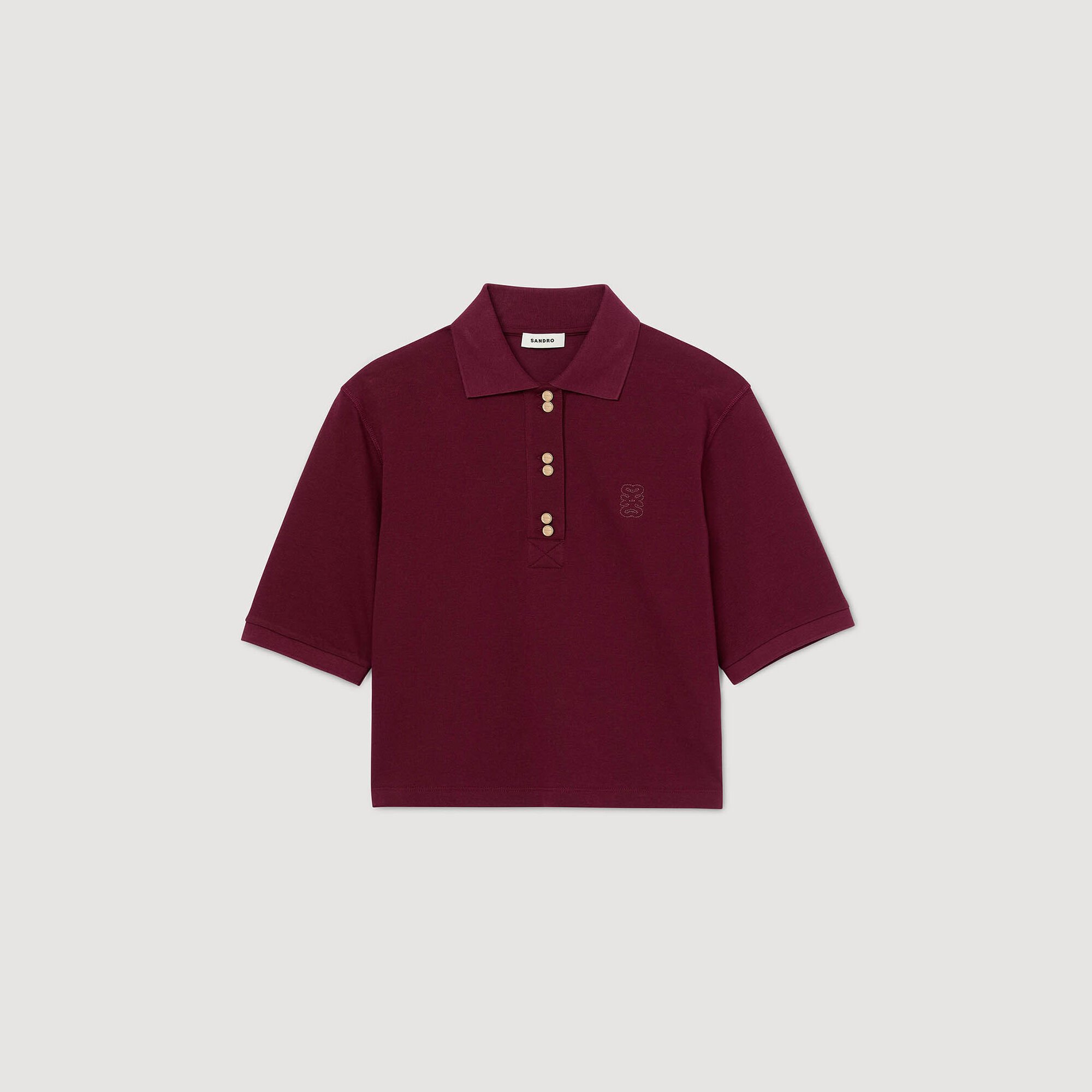 Polo shirt with decorative buttons