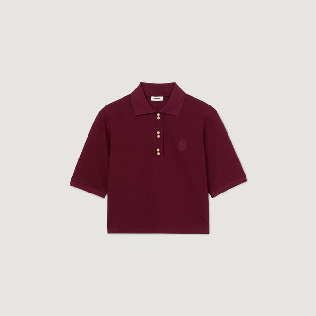 Polo shirt with decorative buttons