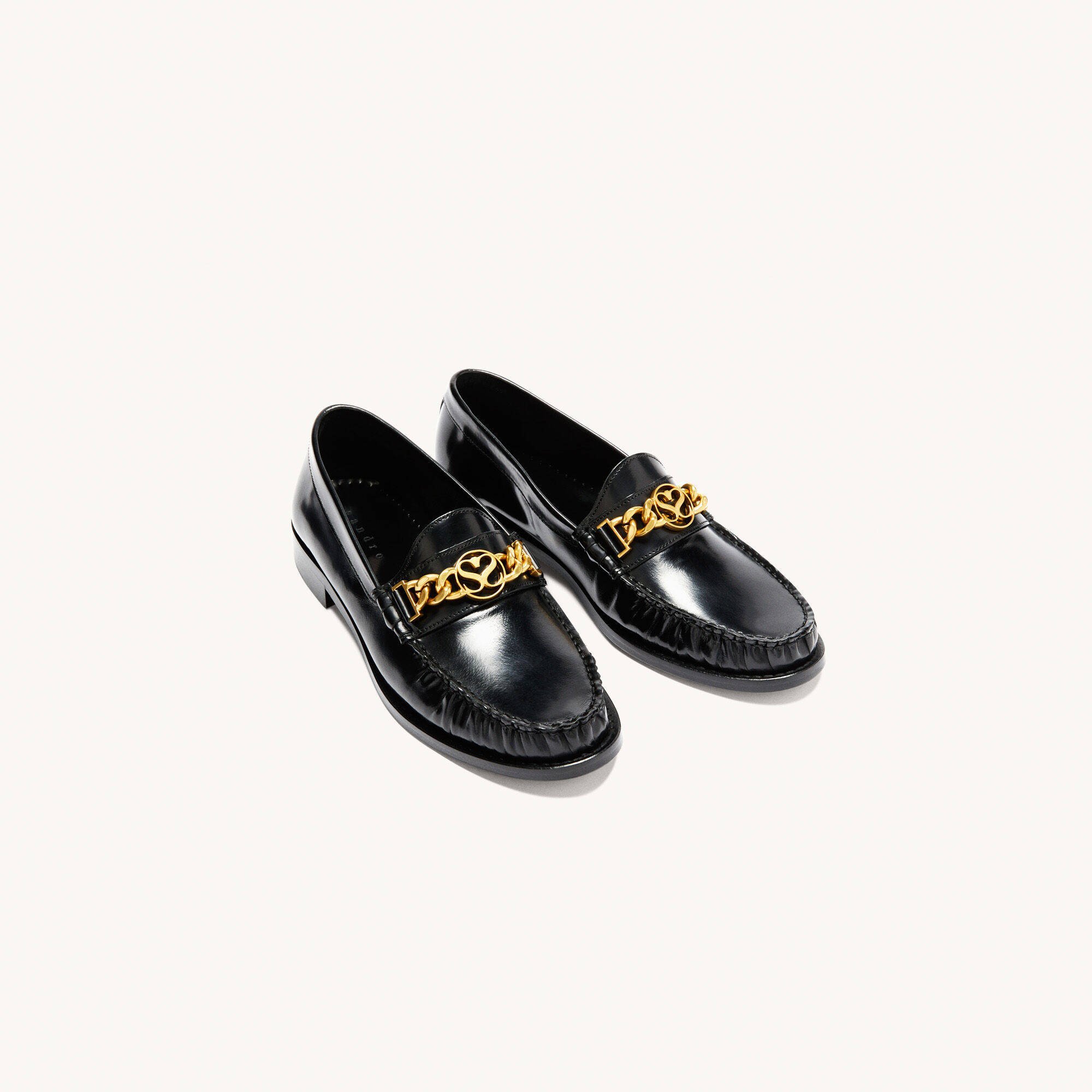 black quilted loafers