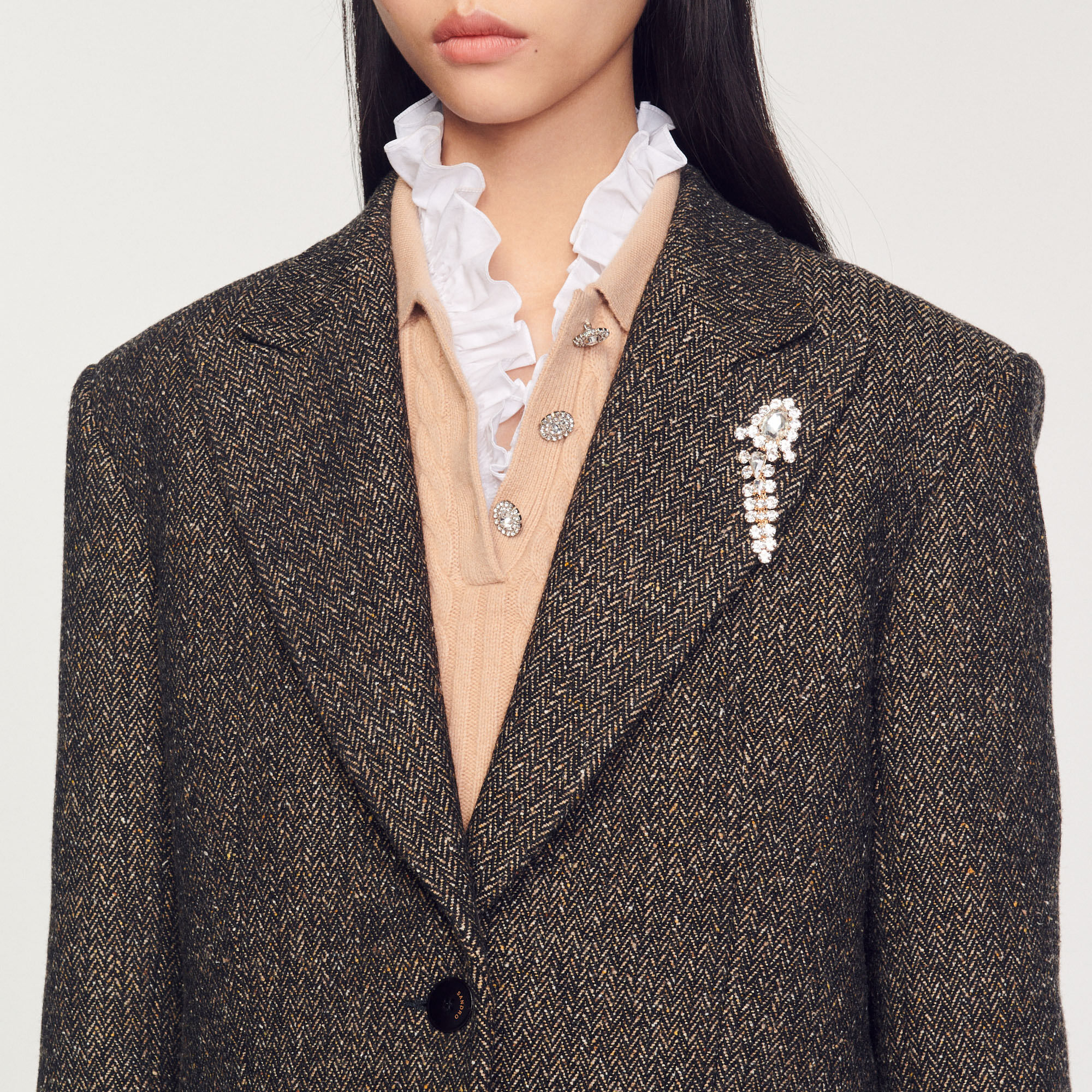 Tailored jacket with embellished brooch