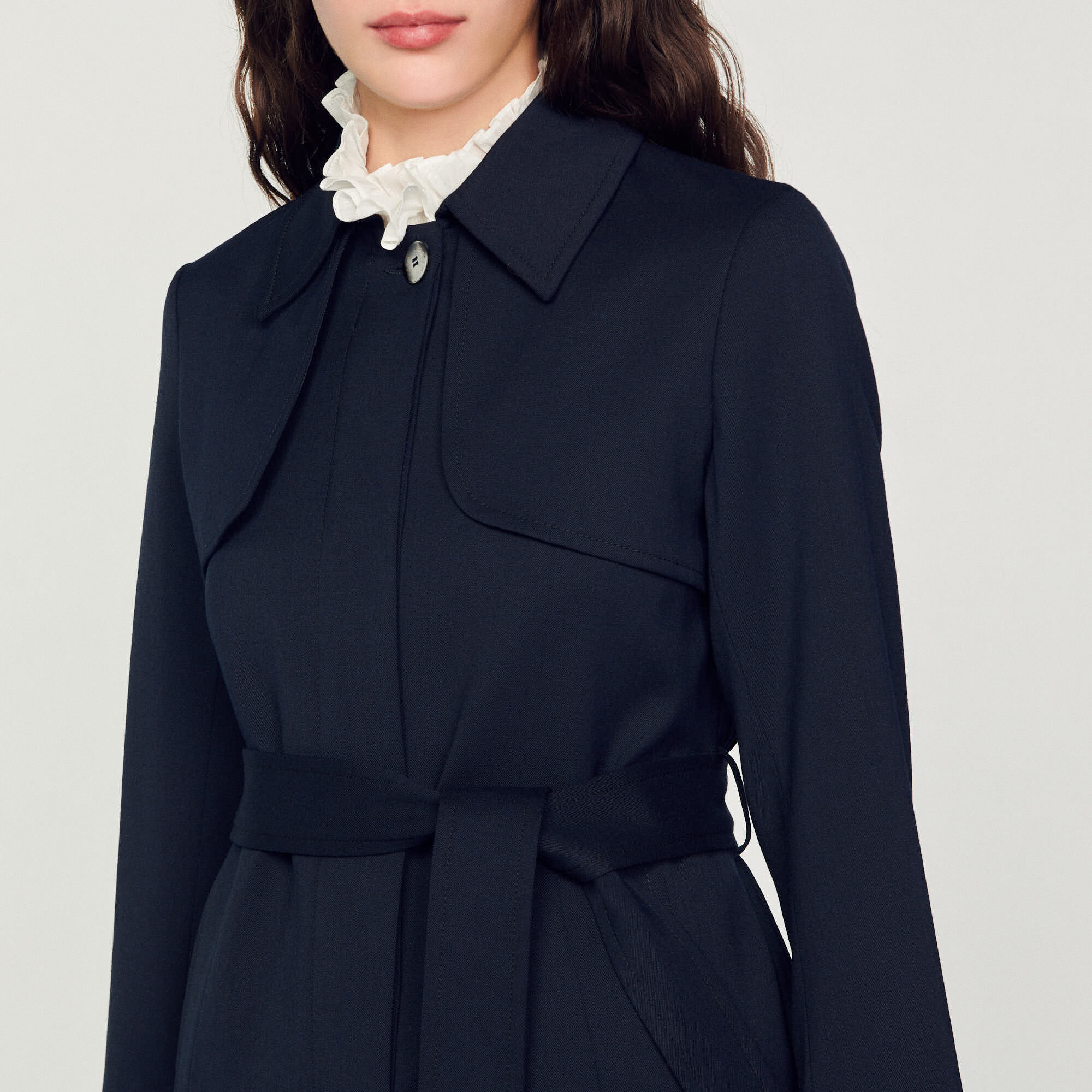 Trench coat with pleated inset