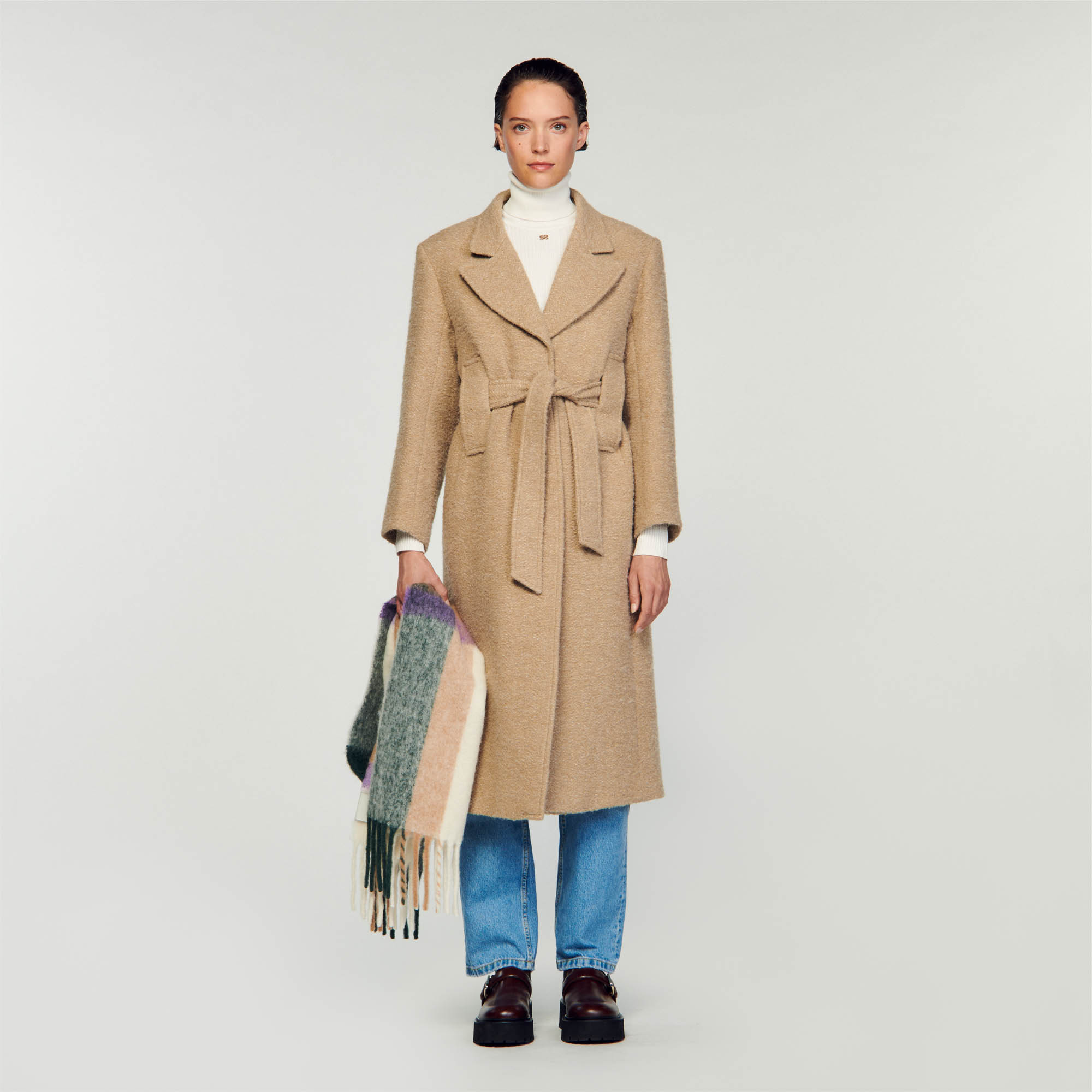 Sandro cotton Slim-fit long coat in bouclé fabric with long sleeves featuring plackets on the cuffs, a wide turn-up lapel collar, a flap at the back and a tone-on-tone tie belt on the waist
