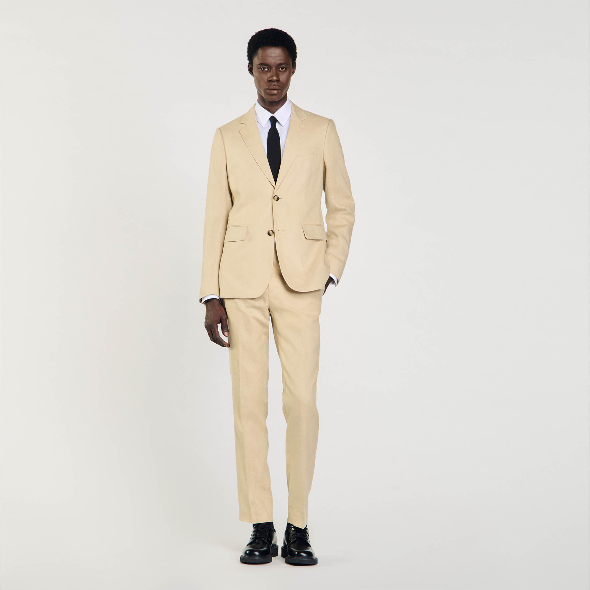 Sandro linen Body lining: Linen suit jacket with a classic cut, a back vent, long sleeves with buttoned cuffs, a two-button fastening, and flap pockets