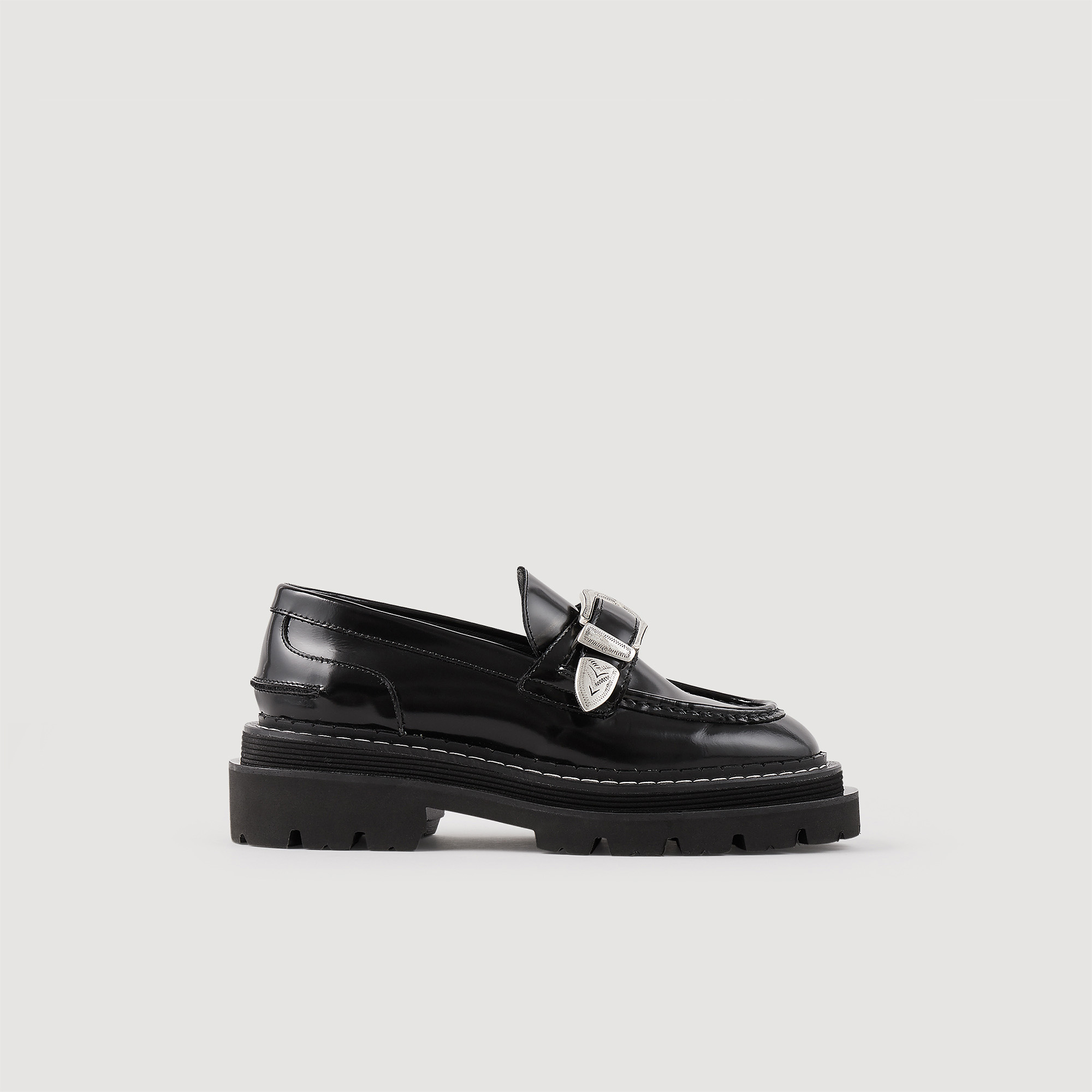 Sandro rubber Shiny leather loafers with a thick sole with a tread and embellished with a metal western buckle strap