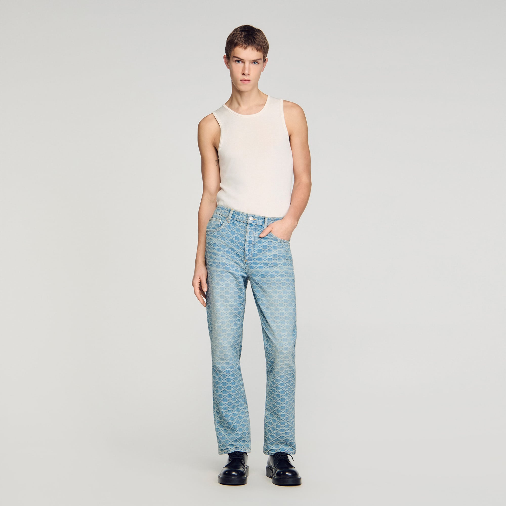 Sandro cotton Regular-fit jeans featuring a Square Cross jacquard pattern, five pockets and an embossed Sandro leather jacron on the back