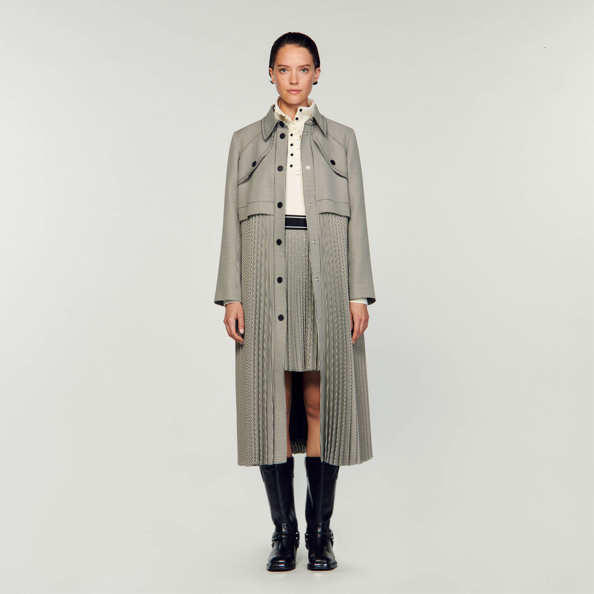 Sandro polyester Lining: Long trench coat with houndstooth pattern, embellished with pleated yokes, removable belt, long sleeves with tab cuffs, Sandro stamped press-stud fastening, flap hem and slit pockets on the sides