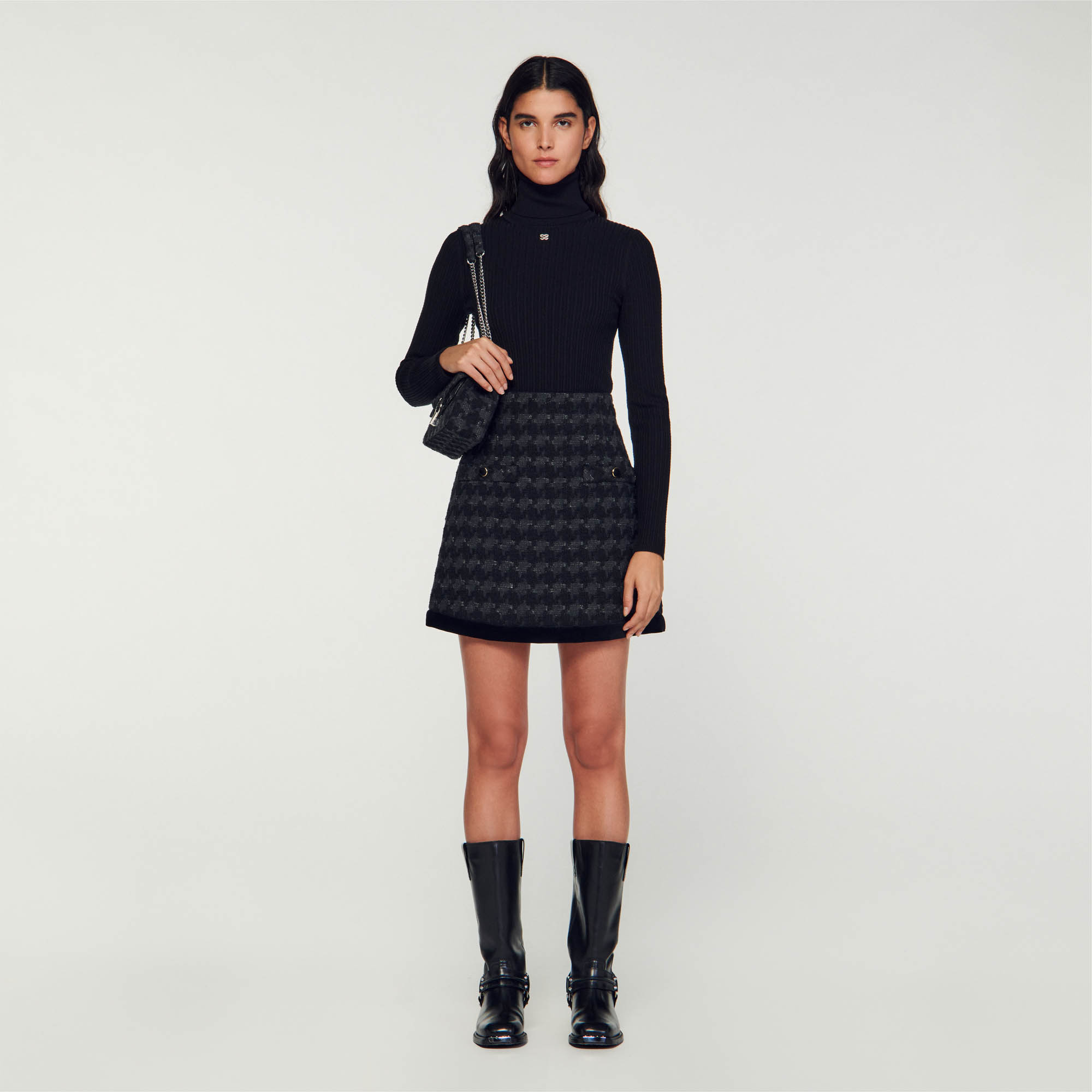 Sandro cotton Short tweed skirt featuring a houndstooth pattern, a contrasting velvet band on the bottom and mock pockets with buttons on the front