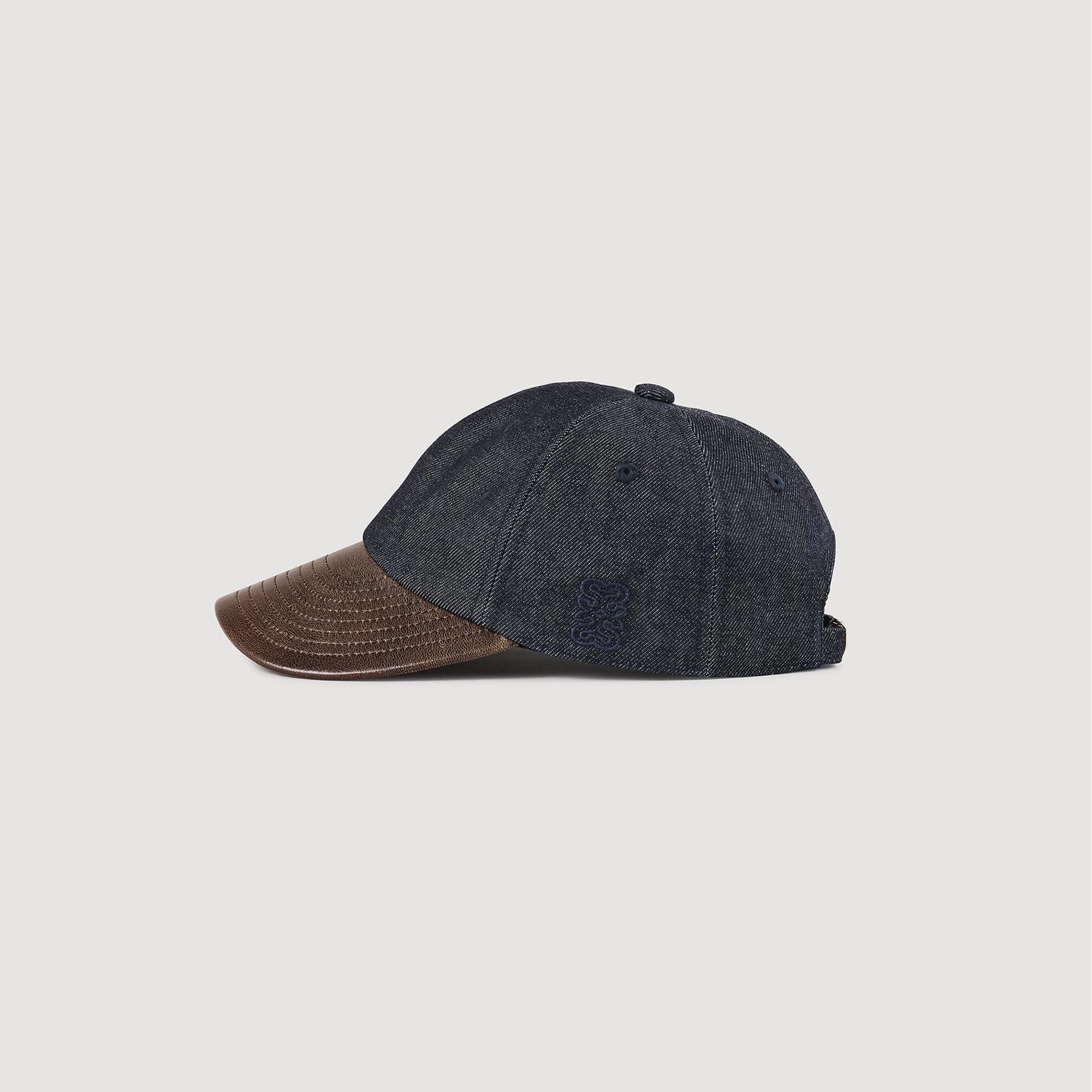 Denim and leather cap