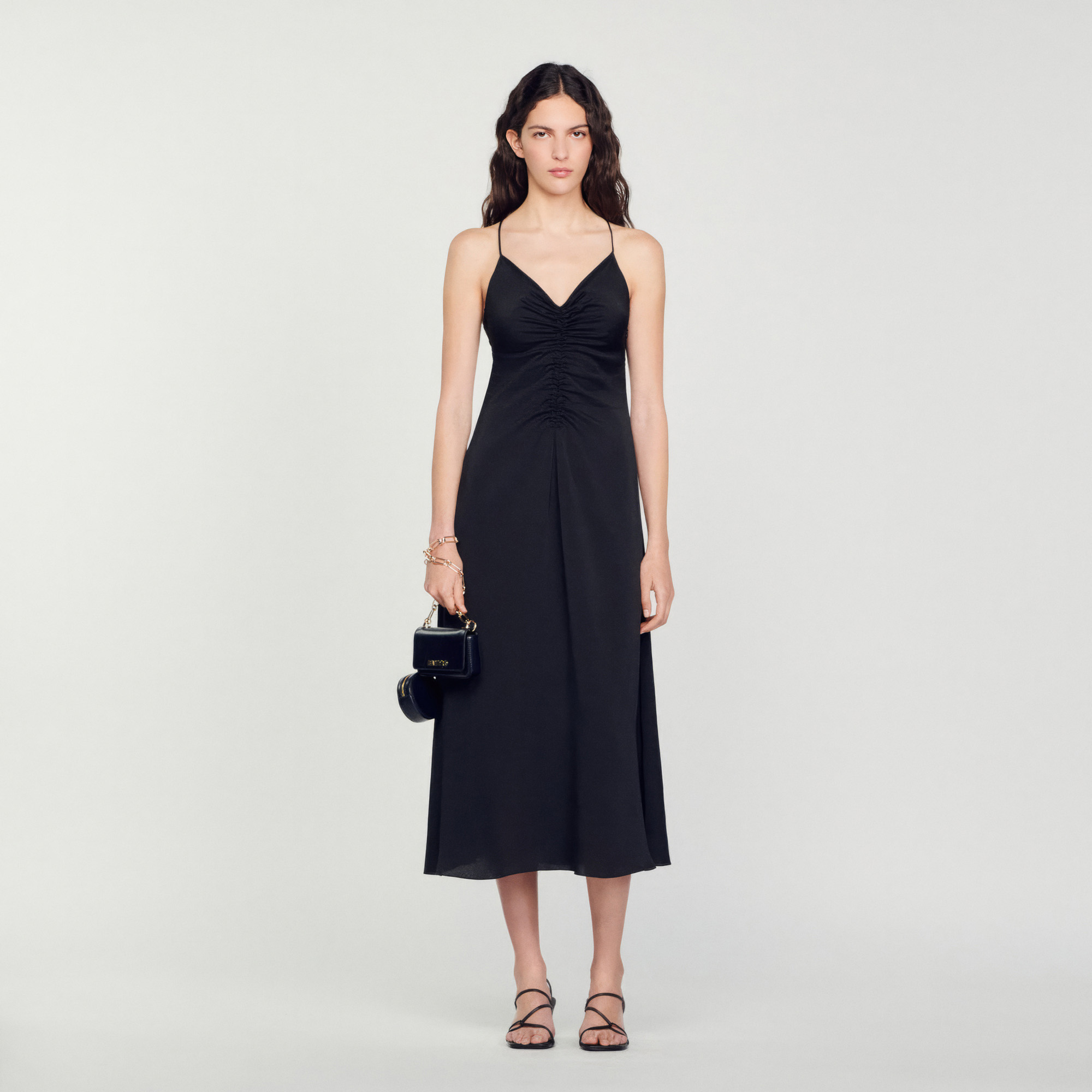Sandro polyester Sandro women's dress â€¢ Long dress with narrow straps â€¢ V-neck â€¢ Crossover straps tied at the back â€¢ Gathers at the front â€¢ Figure-hugging bodice â€¢ Flared skirt â€¢ Midi length â€¢ Concealed zip fastening at the side The model is 5'10 tall and wears a size 36 FR / 4 US