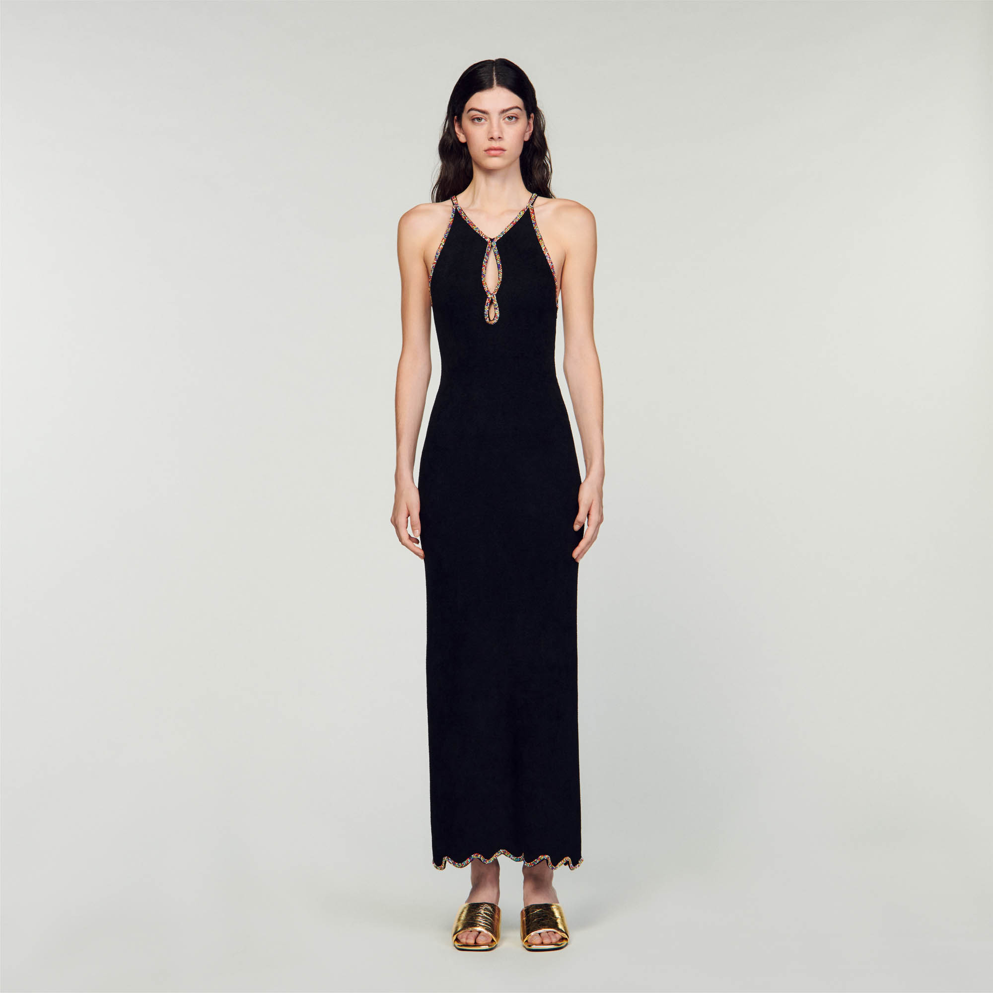 Sandro viscose Maxi dress in velvet knit with American-style armholes, featuring a neck with a cutaway teardrop embellished with multicoloured rhinestones and slit at the back