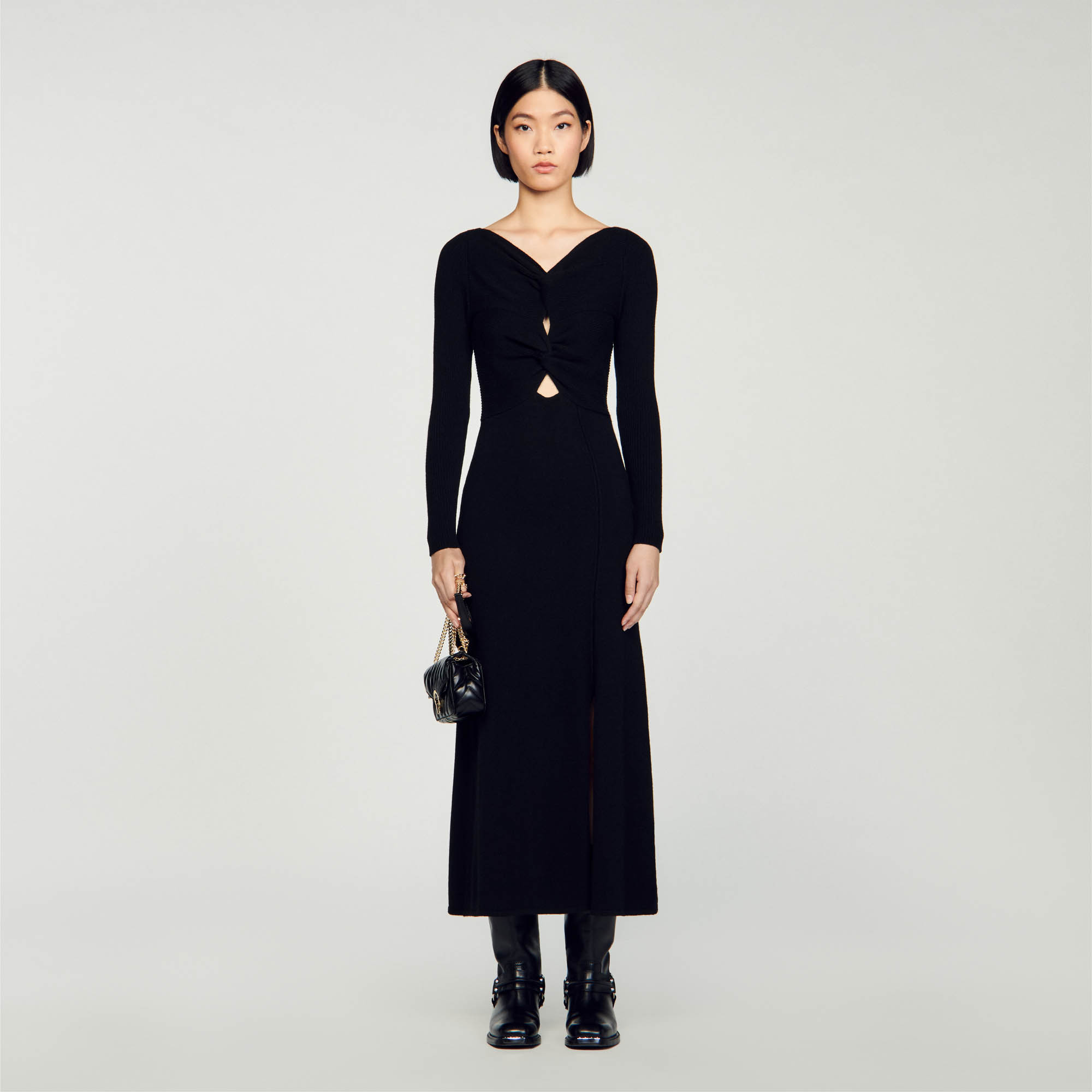Sandro wool Maxi dress made of openwork cable knit with round neck, long sleeves and side slits