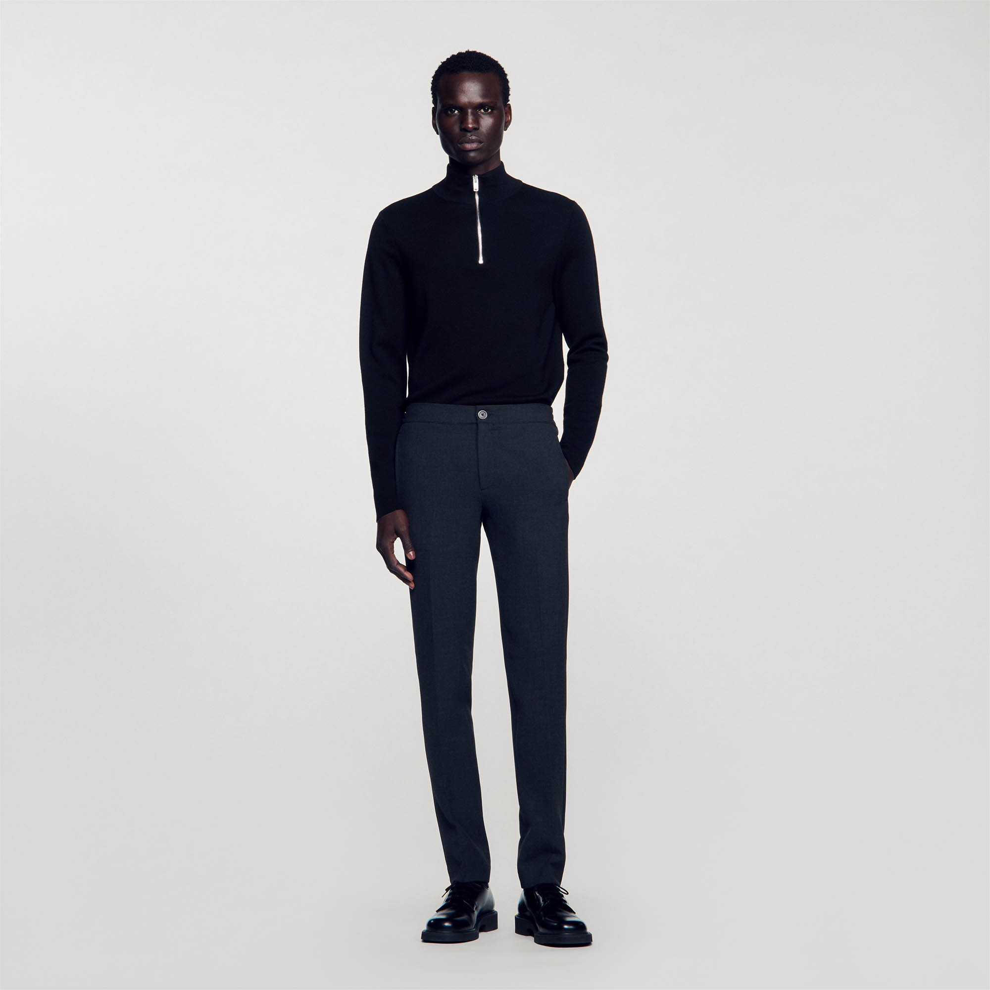 Sandro polyester Sandro men's pants â€¢ Jersey pants â€¢ Button fastening at the front â€¢ Elasticated waist at the back â€¢ Slanted pockets at the front â€¢ Two piped pockets at the back â€¢ The model is wearing a size 38