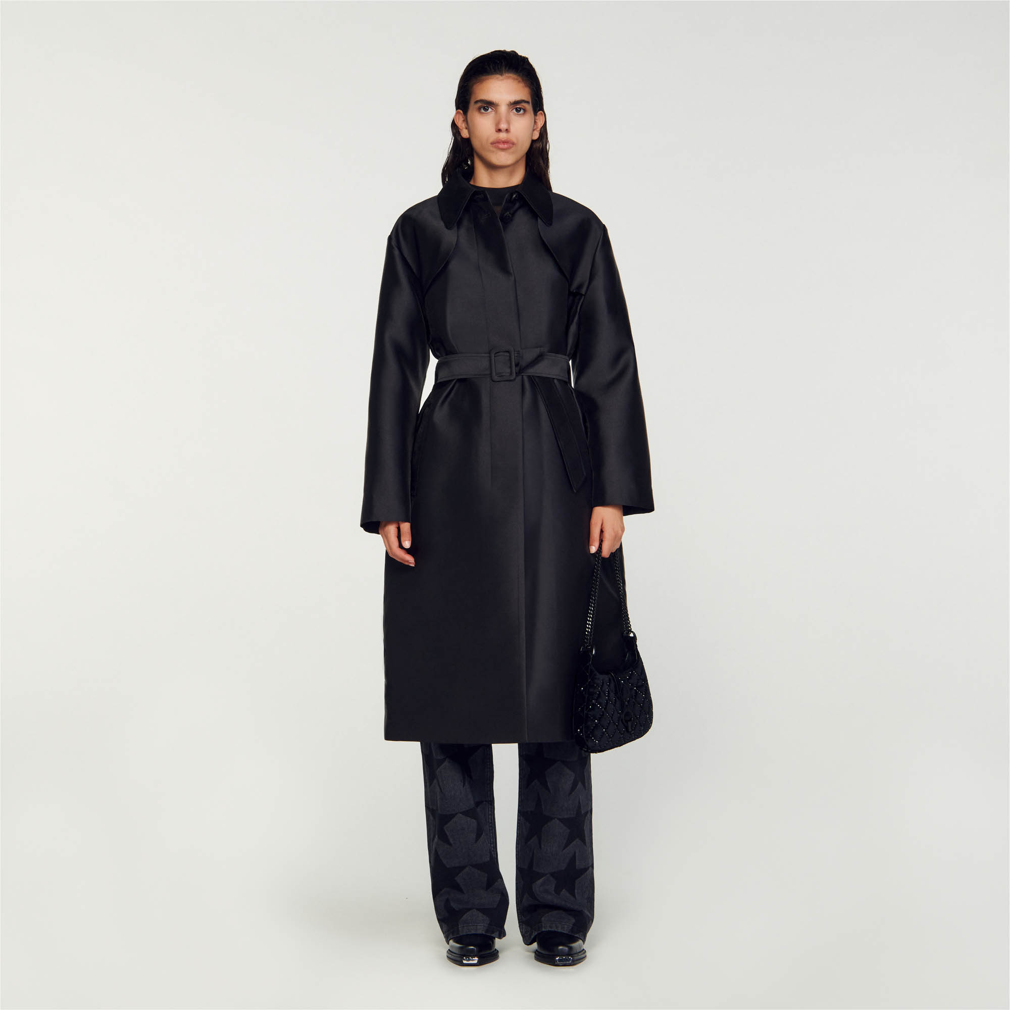 Sandro polyester Lining: Shiny fabric trench coat with shirt collar, long sleeves, flap along bottom, button fastening, pockets and removable tone-on-tone belt that ties at the waist