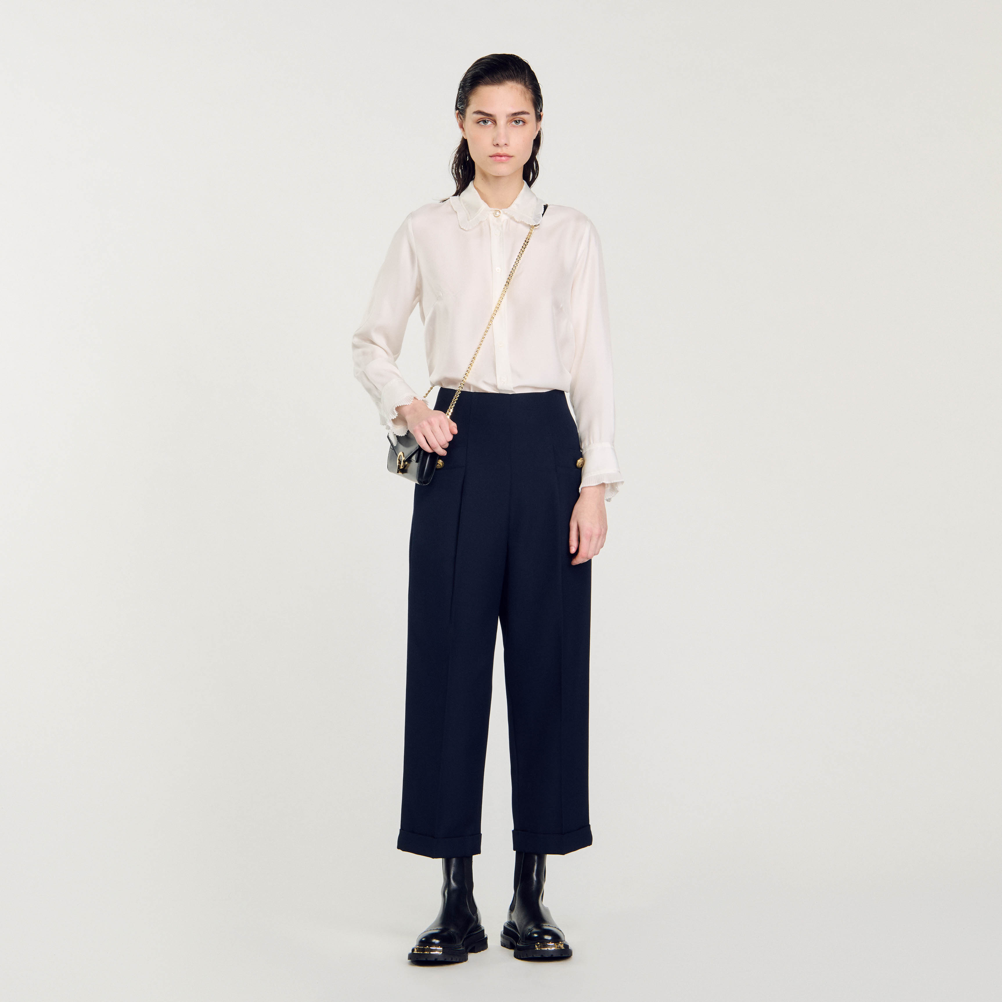 Sandro polyester Sandro women's pants â€¢ Buttoned pockets at the front and piped pockets at the back â€¢ Turn-up hems â€¢ Fastened with a concealed zip at the center back â€¢ These pants match the jacket This item's main material is at least 50% recycled