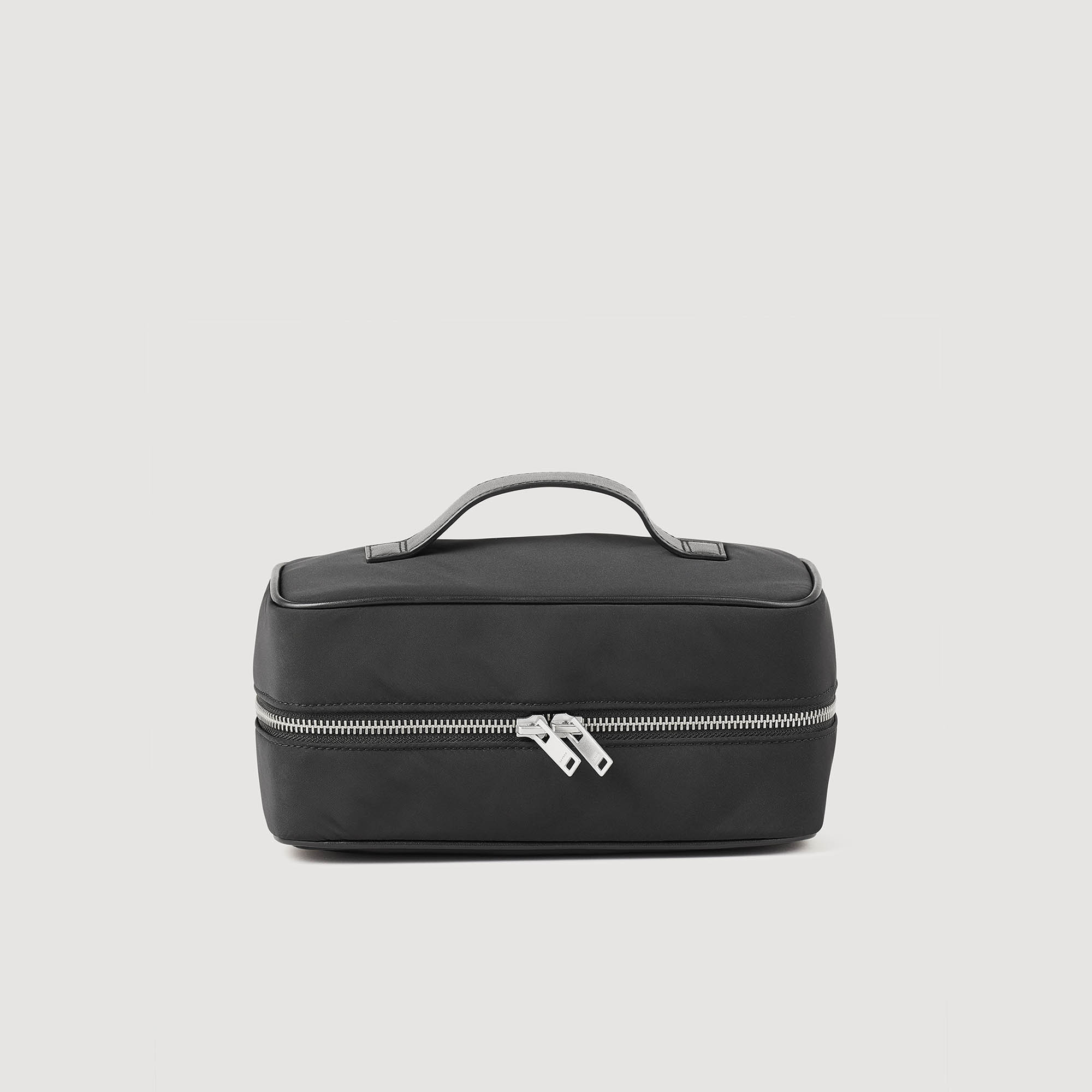 Sandro polyester Lining: Nylon toiletry bag with zip fastening, leather handle on top, and technical fabric interior