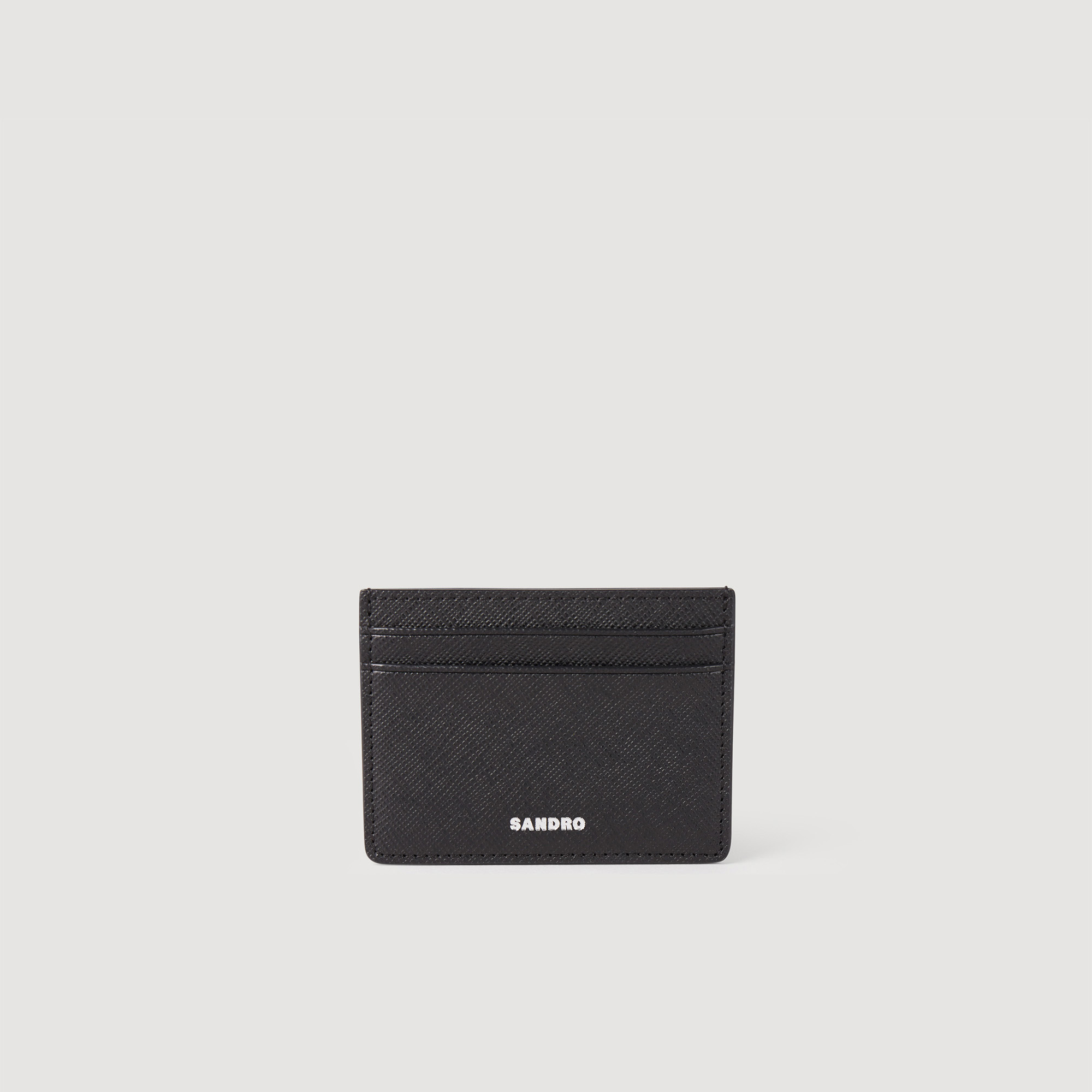 Sandro synderm Coating: Sandro men's leather card holder â€¢ Saffiano leather card holder â€¢ Four slots â€¢ One compartment â€¢ Embossed Sandro logo â€¢ Dimensions: 4 x 3 in By purchasing this product, you are supporting more responsible leather manufacturing via the Leather Working Group, which certifies tanneries based on their environmental performance (water, energy, waste, etc